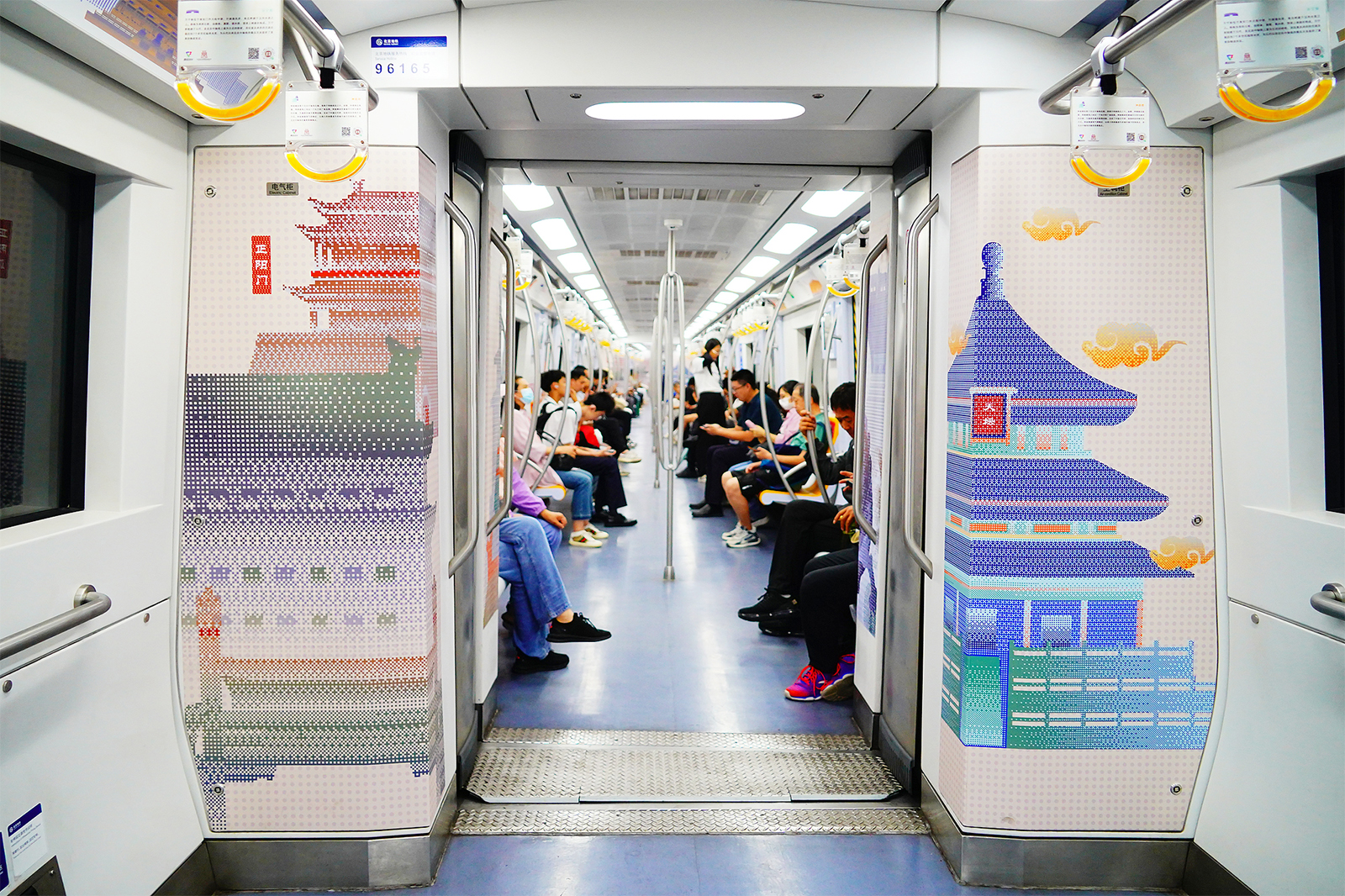 Passengers take the Beijing Central Axis-themed subway train in Beijing on September 9, 2024. /CFP