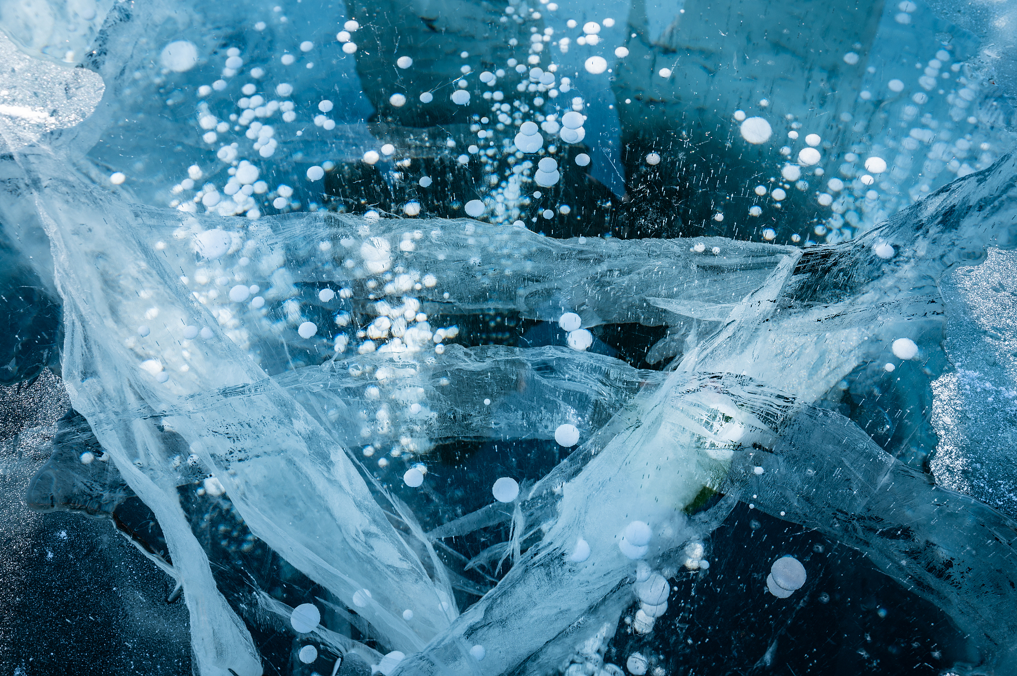 Methane bubbles in a frozen lake. /CFP