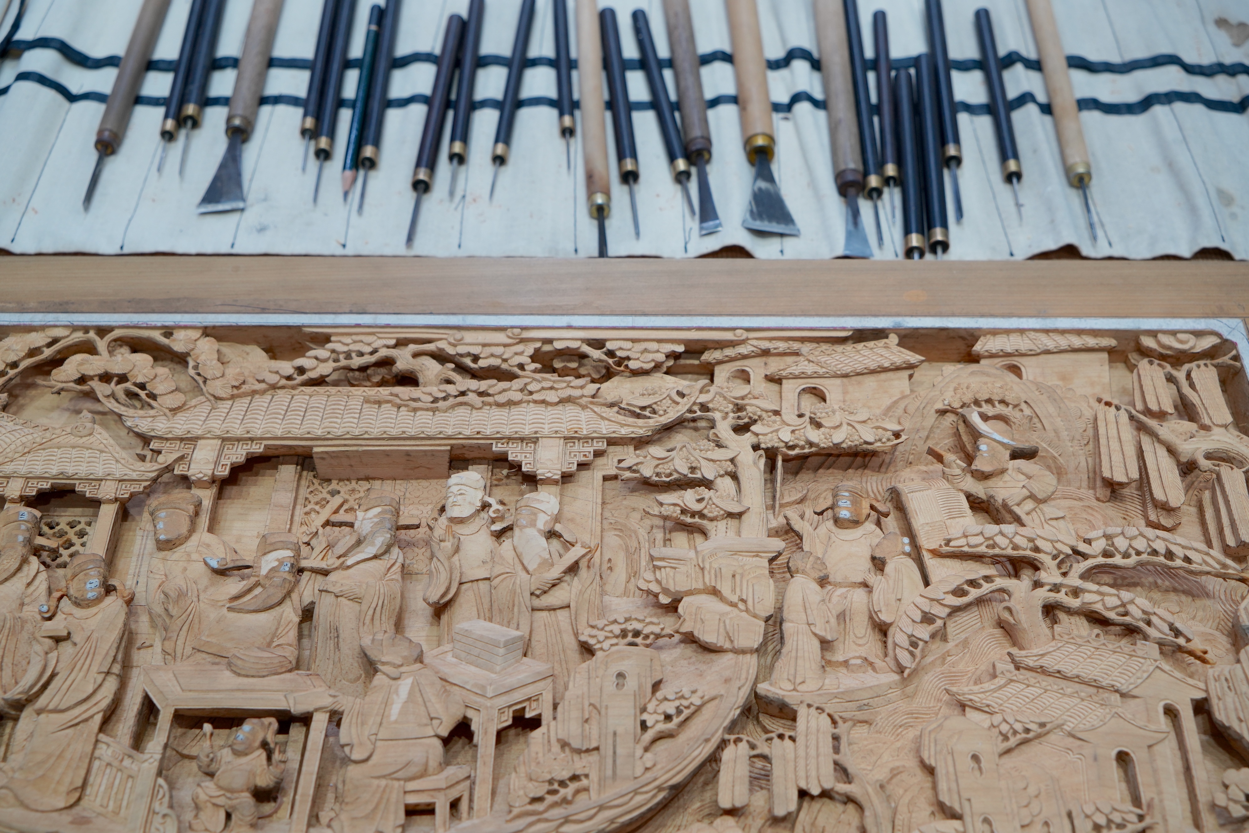 A piece of Wuyuan wood carving work is pictured at an intangible cultural heritage exhibition held this autumn in northwest China's Xinjiang Uygur Autonomous Region. /CGTN