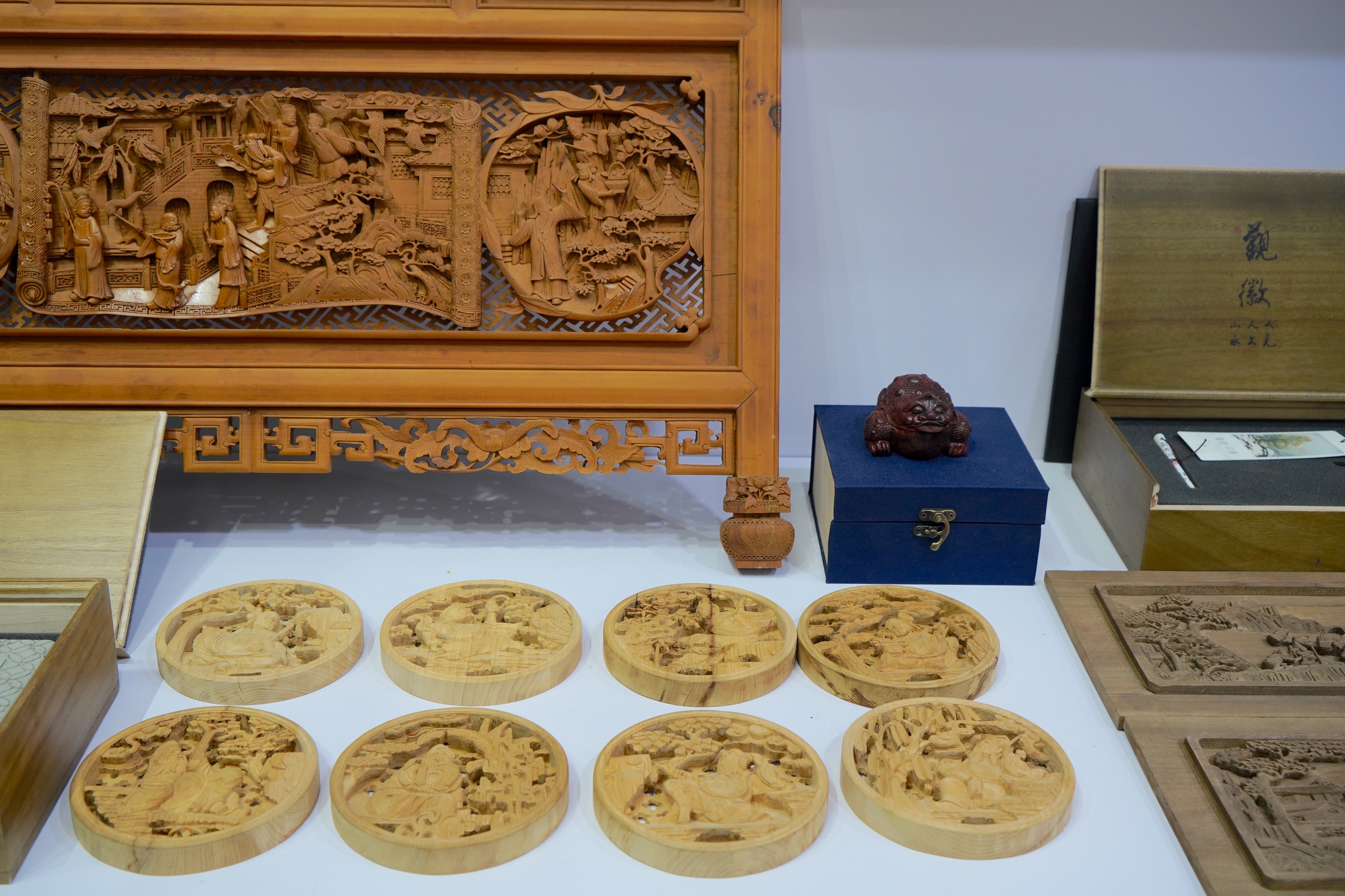 Works of Wuyuan wood carving are pictured at an intangible cultural heritage exhibition held this autumn in northwest China's Xinjiang Uygur Autonomous Region. /CGTN