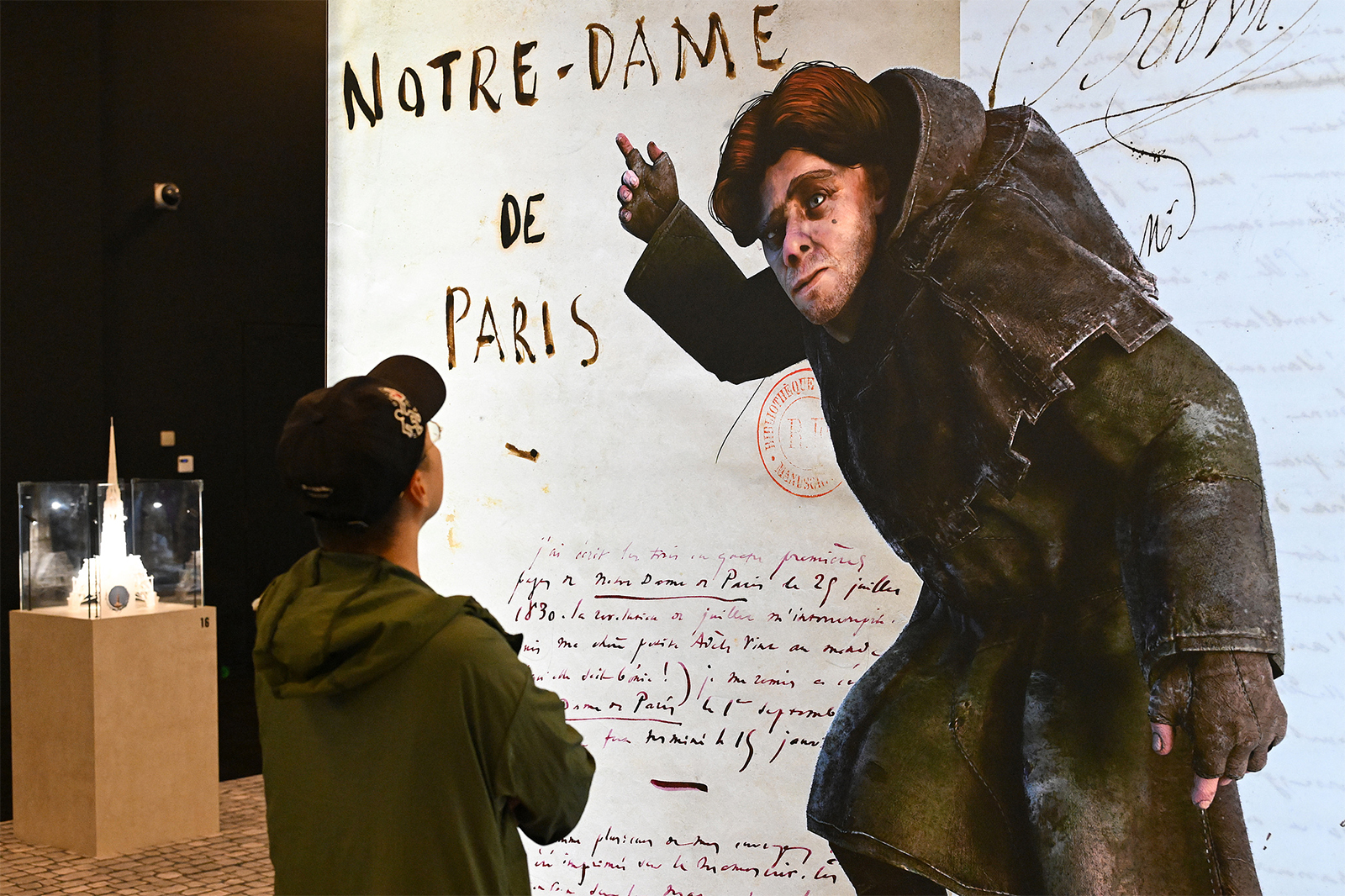 A visitor views an augmented reality exhibition on the history and restoration of Notre-Dame de Paris at the National Museum of China in Beijing on September 11, 2024. /CFP