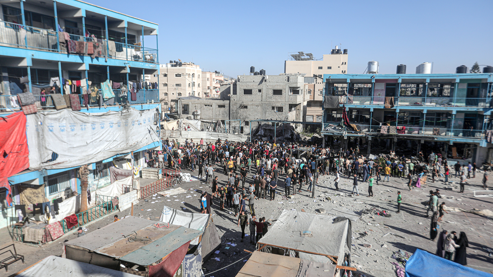 Civil defense teams and Palestinian residents launched a search and rescue operation after the Israeli army targeted a UN School, where thousands of displaced people took refuge at the Nuseirat refugee camp in Gaza, September 11, 2024. /CFP