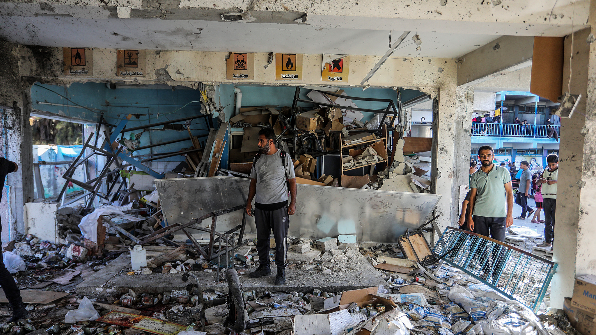 Civil defense teams and civilians carry out search and rescue operations from the rubble after an Israeli attack at a UN school at Nuseirat refugee camp in Gaza, September 11, 2024. /CFP