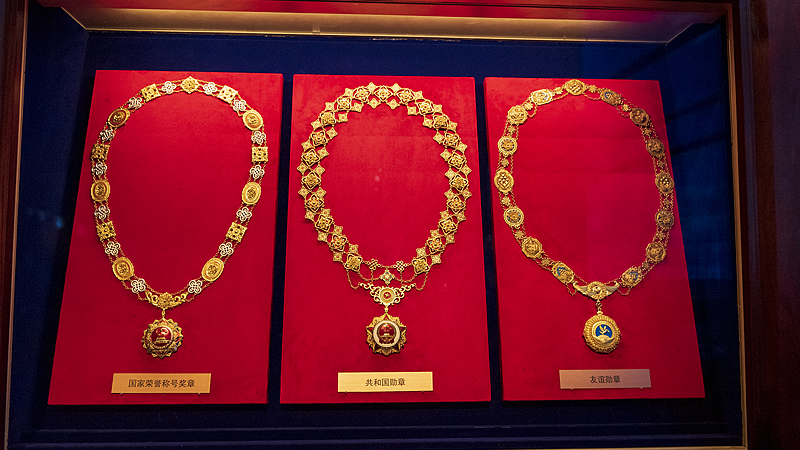 (L-R) The Medal of National Honorary Titles, the Medal of the Republic, and the Friendship Medal are on display at the Museum of the Communist Party of China in Beijing, China, October 14, 2023. /CFP