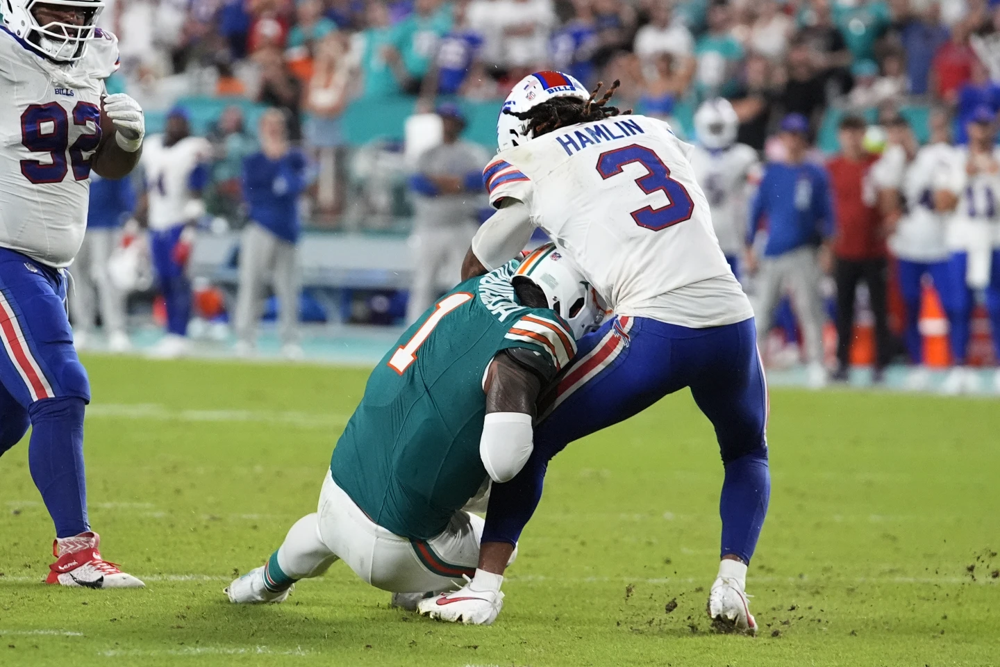 Quarterback Tua Tagovailoa (#1) of the Miami Dolphins collides with safety Damar Hamlin of the Buffalo Bills in a National Football League (NFL) game at Hard Rock Stadium in Miami Gardens, Florida, September 12, 2024. /AP