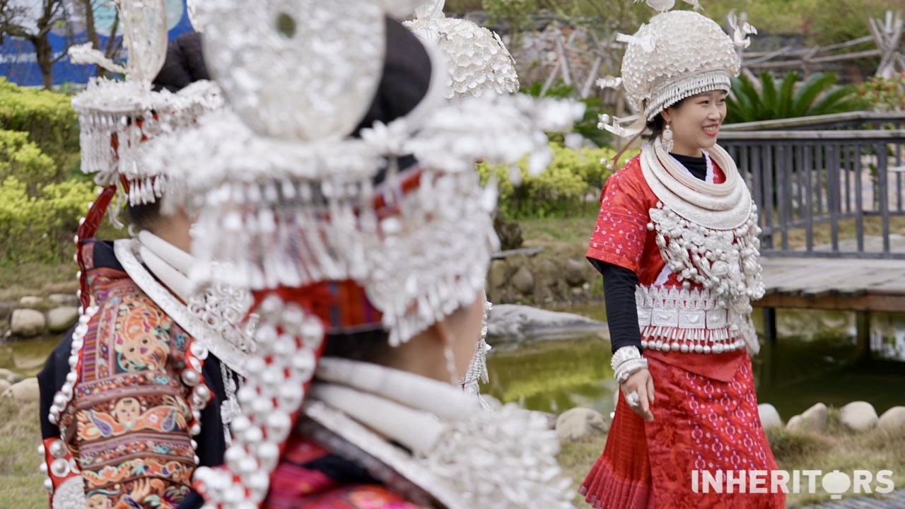 Two Miao women are seen wearing silver. /CGTN