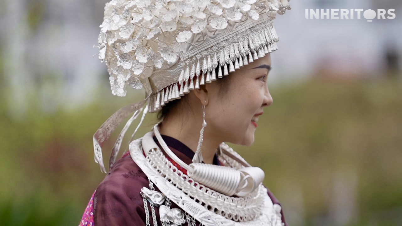 A Miao woman is seen wearing silver. /CGTN