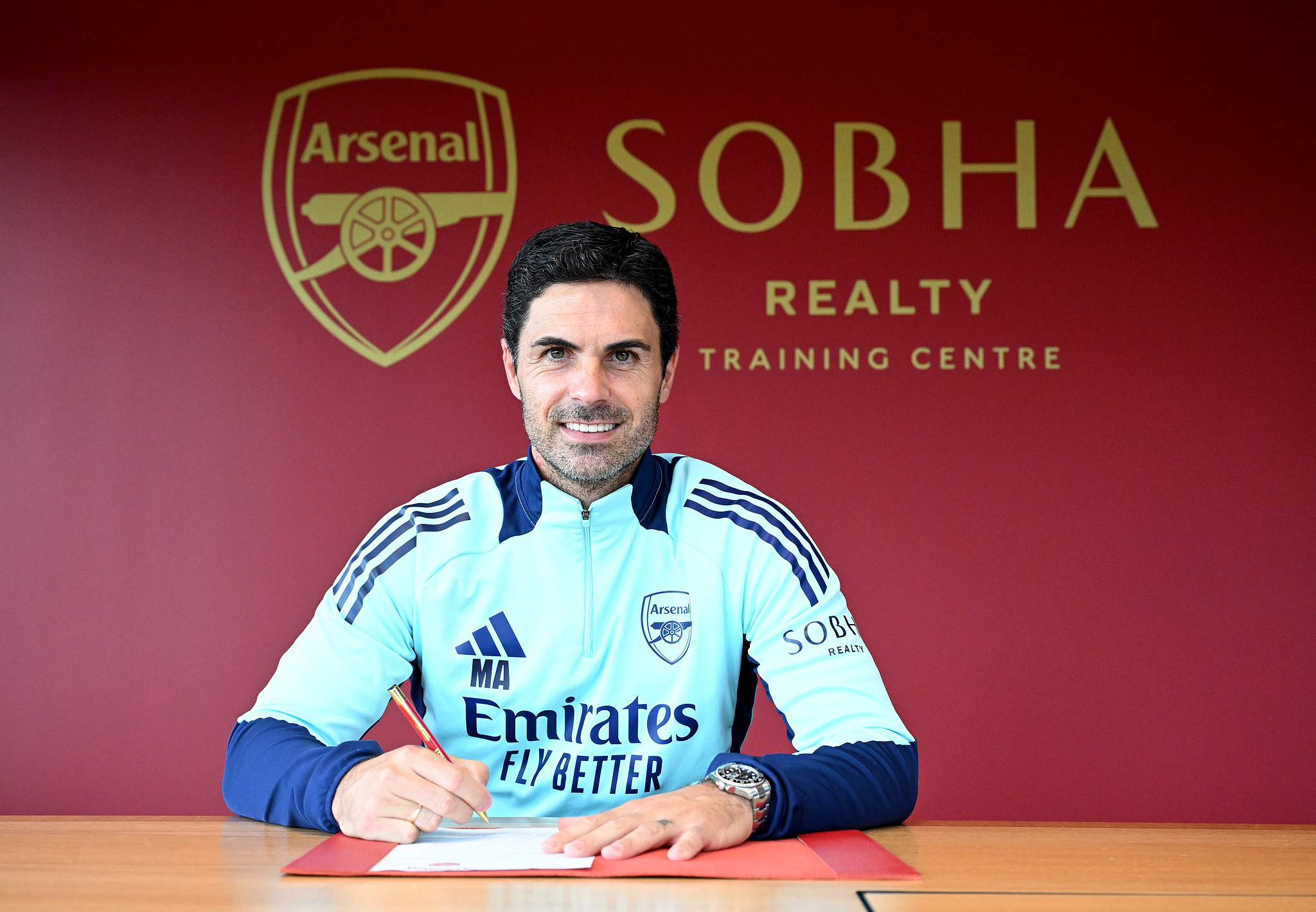 Mikel Arteta, manager of Arsenal, signs a three-year contract extension with the club at Sobha Realty Training Centre in London Colney, England, September 12, 2024. /CFP