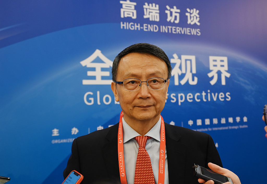 Jia Qingguo, a professor from the School of International Studies at Peking University, takes interview from reporters, Beijing, China, September 12, 2024. /CFP