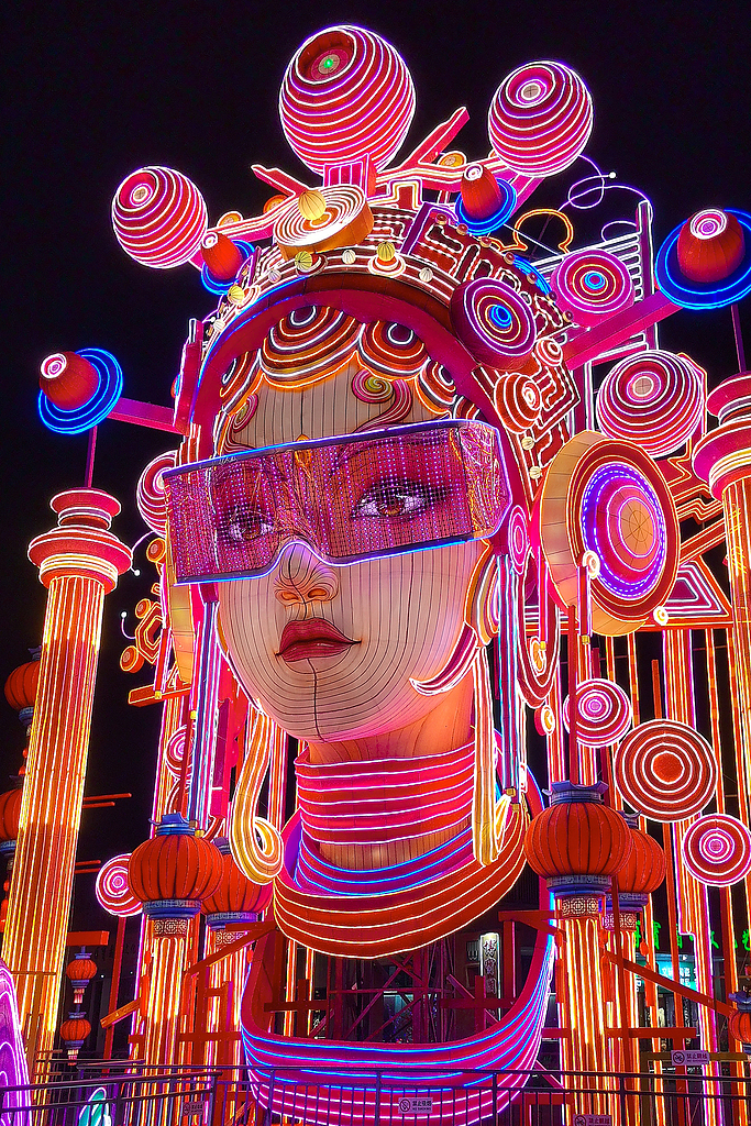 A lantern sculpture shows a woman in a Beijing Opera costume wearing VR glasses at the Beijing Garden Expo Park on September 14, 2024. /CFP