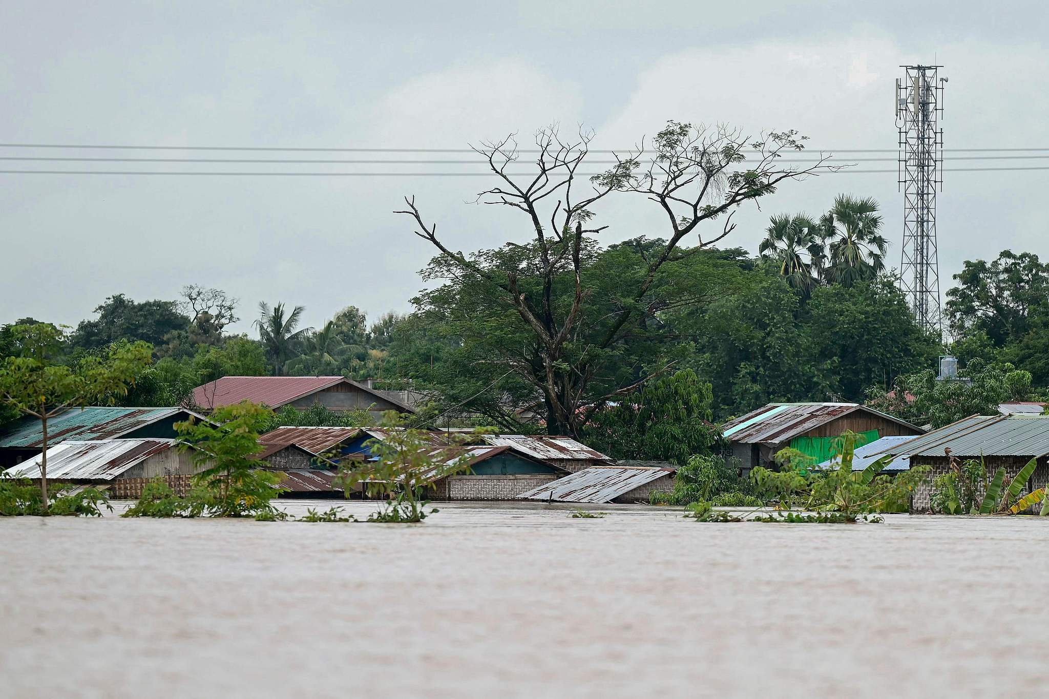 Following heavy rains, water surrounds houses in Taungoo, Bago region, Myanmar, September 14, 2024. /CFP