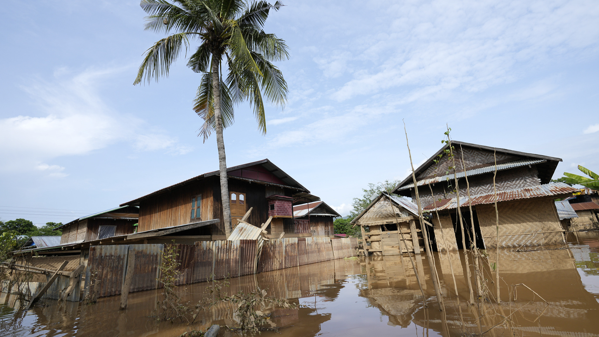 Partially submerged buildings are seen along a flooded road in Nay Pyi Taw, the capital of Myanmar, September 15, 2024. /CFP