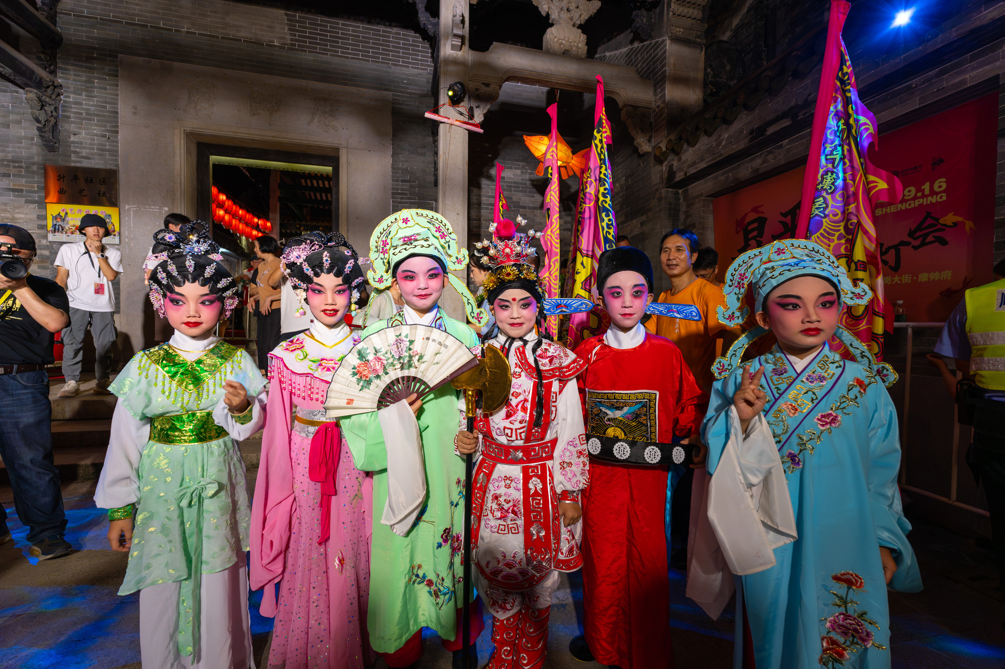 Students pose in Cantonese Opera costumes at the fourth Daliang Fish Lantern Festival in Foshan, Guangdong Province on September 15, 2024. /CFP