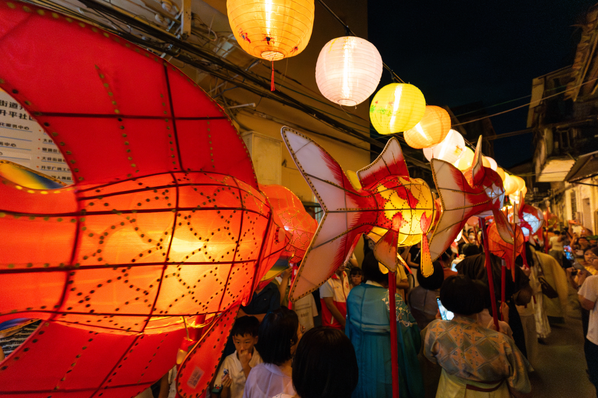 A street packed with people and lanterns is seen at the fourth Daliang Fish Lantern Festival in Foshan, Guangdong Province on September 15, 2024. /CFP