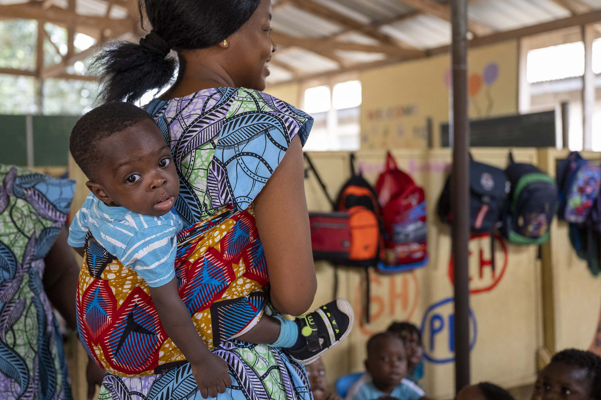 A woman with her child stands in the school of the Sunbeam Foundation in Kokrobite, Ghana, February 21, 2023. /CFP