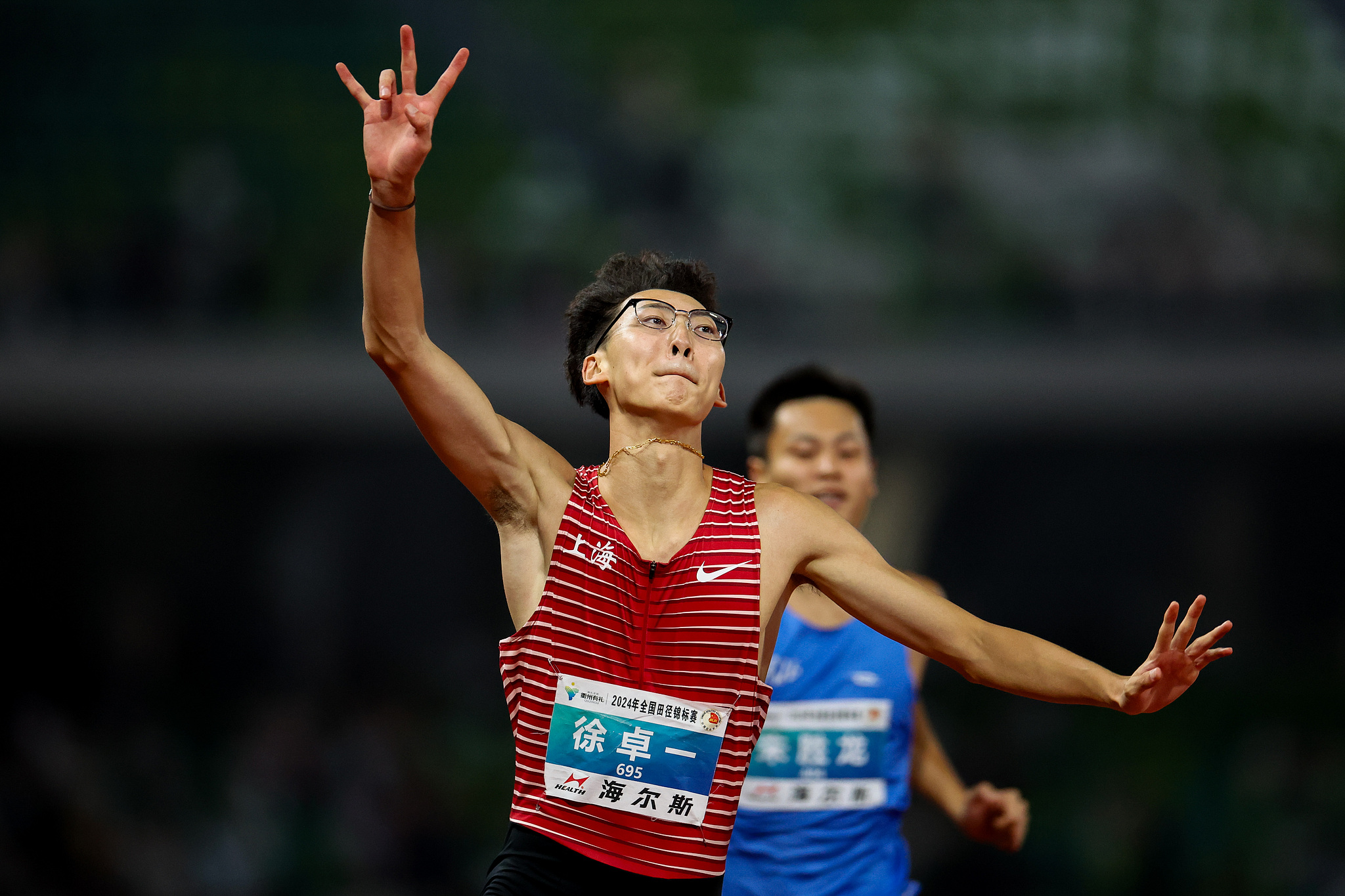 Xu Zhuoyi of China celebrates after winning the men's 110m hurdles during the National Athletics Championships in Quzhou, China, September 16, 2024. /CFP