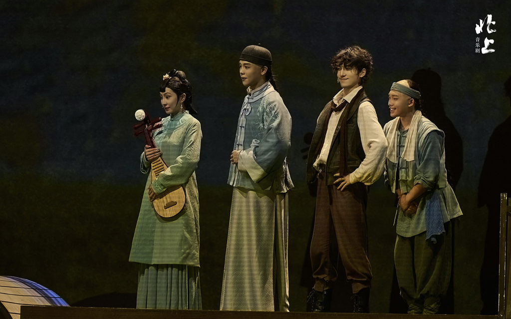 Jia Fan (2nd L) as Xie Pingyao and Alading Asihali (2nd R) as Paolo Di Marco in a stage photo of the musical 