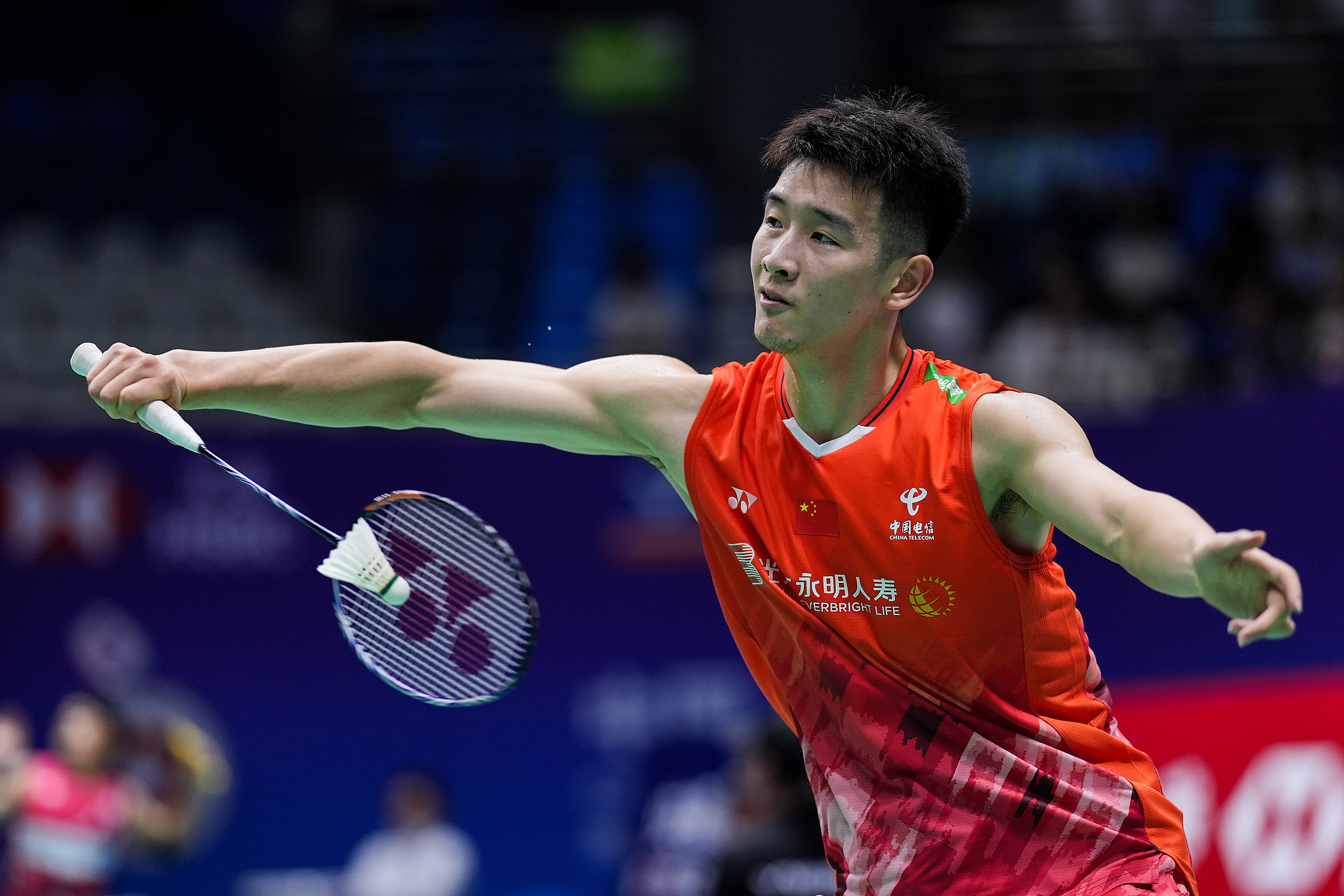 Li Shifeng of China hits a backhand against Chou Tien-Chen of Chinese Taipei in their men's singles first round match at the BWF China Open in Changzhou, China, September 18, 2024. /CFP