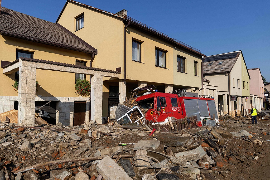 A destroyed fire brigade is seen among debris following heavy flooding in Stronie Slaskie, southern Poland, September 18, 2024. /CFP