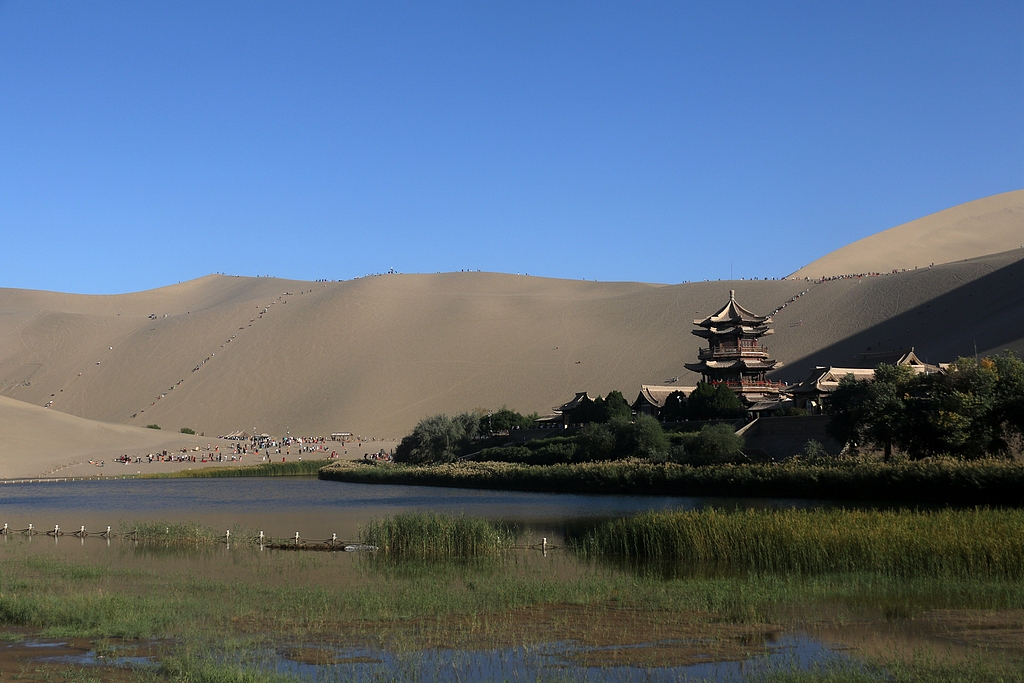 A photo taken on September 16, 2024 shows a view of Mingsha Mountain and Crescent Spring scenic spot in Dunhuang, Gansu Province, September 16, 2024. /CFP