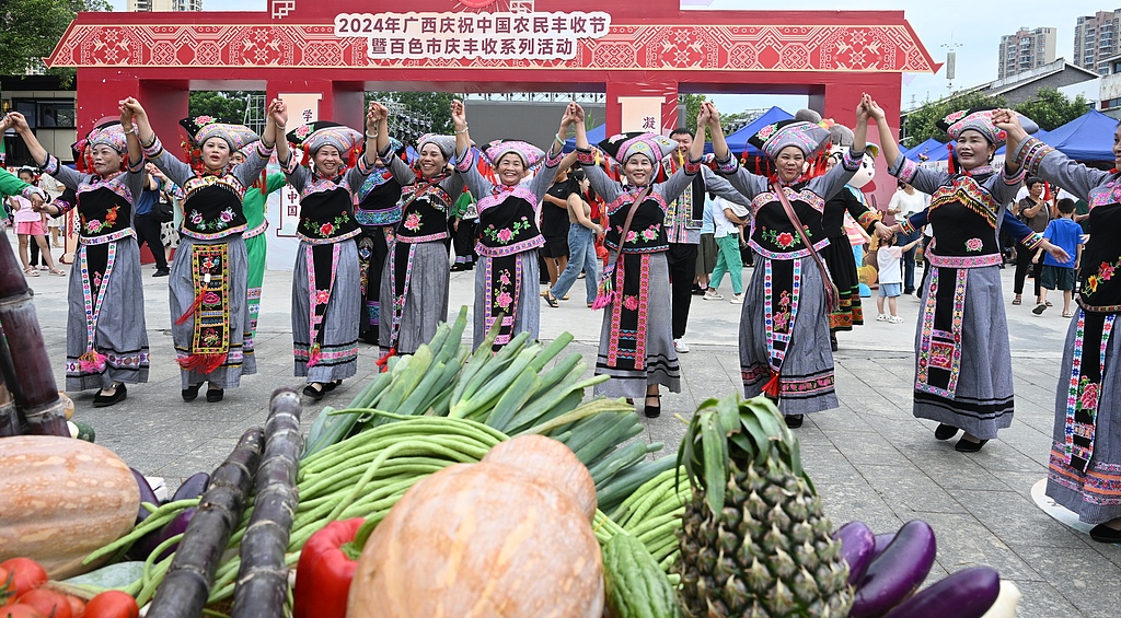 Farmers sang and danced at a park to celebrate the Chinese Farmers' Harvest Festival, Baise City, south China's Guangxi Zhuang Autonomous Region, September 22, 2024. /CFP