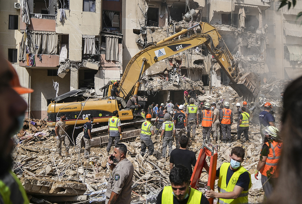 Rescue workers sift through the rubble at the scene of an Israeli strike that targeted Beirut's southern suburbs a day earlier, as search and rescue operations continue on Saturday, September 21, 2024. /CFP