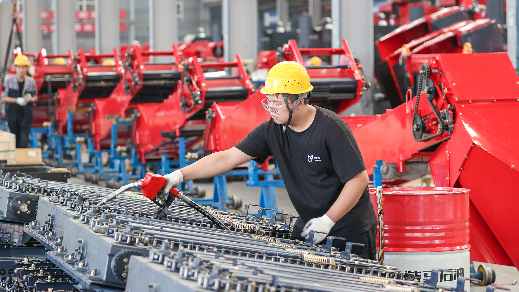 A worker assembling farming equipments in a factory in Xinjiang Uygur Autonomous Region, China, September 14, 2023. /CFP