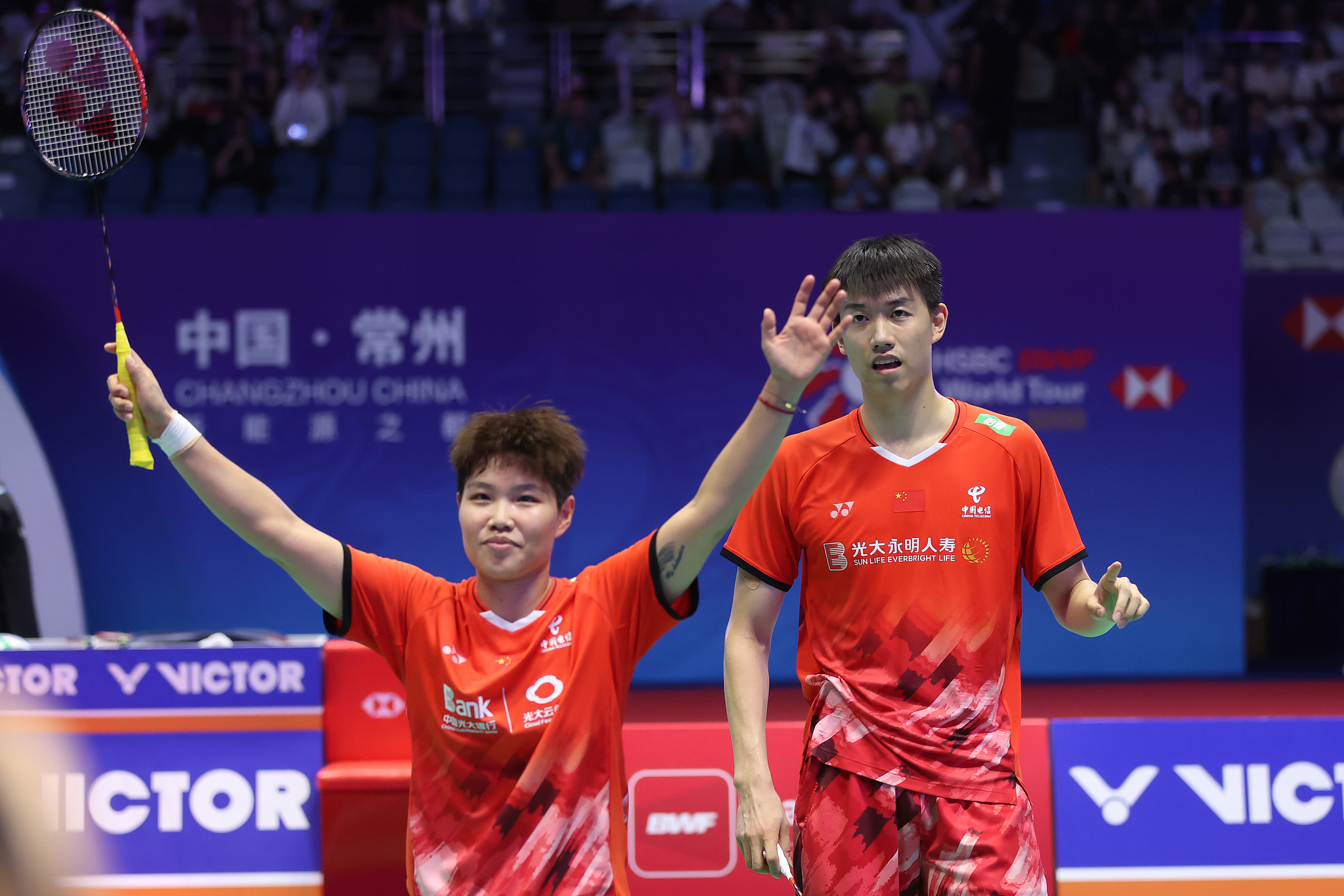 Huang Dongping (L) and Feng Yanzhe of China celebrate after winning the mixed doubles title at the BWF China Open in Changzhou, China, September 22, 2024. /CFP