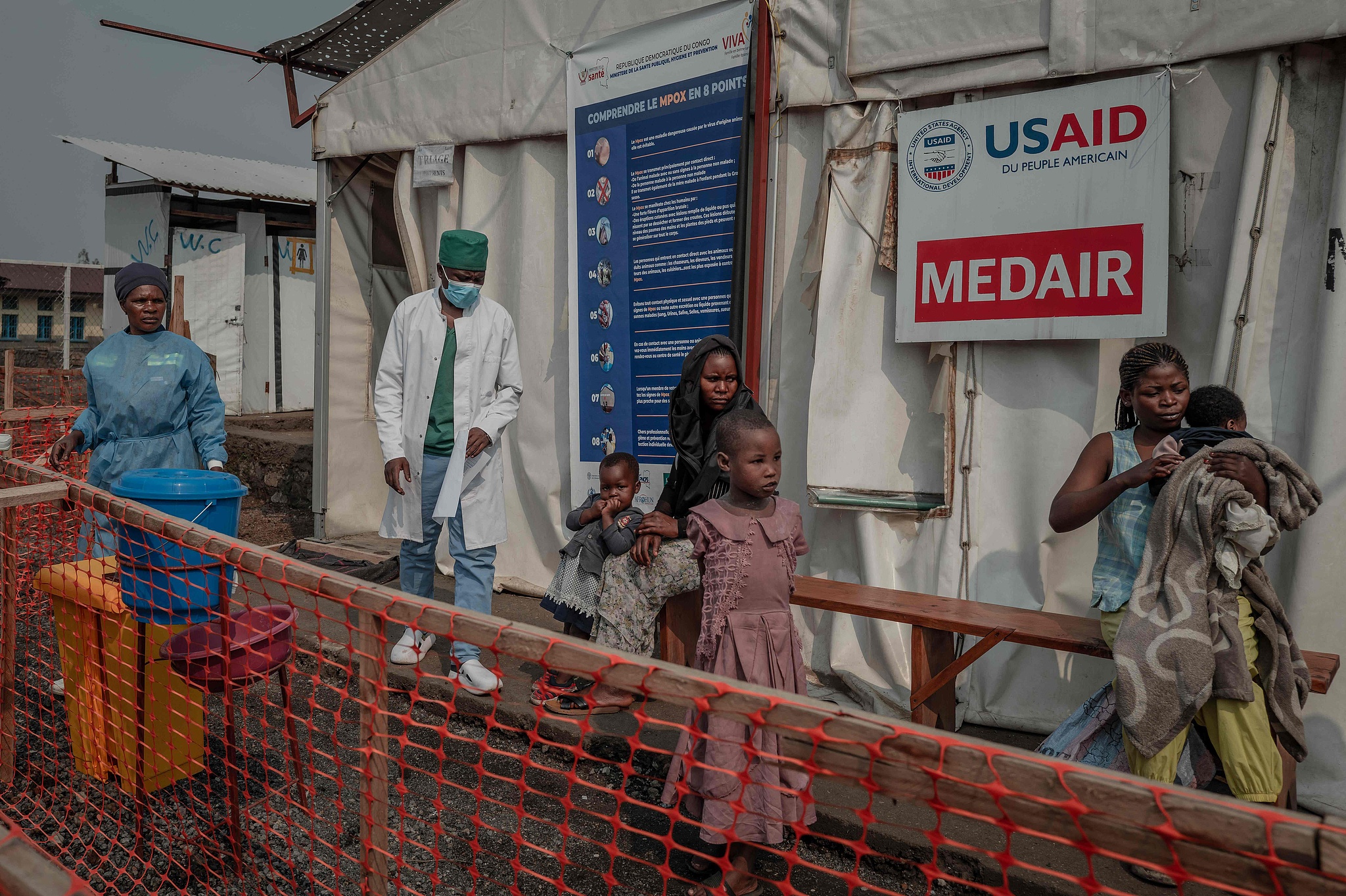 Patients wait outside the consultation room at the mpox treatment center in Nyiragongo General Reference Hospital, north of Goma, Democratic Republic of Congo, August 16, 2024. /CFP