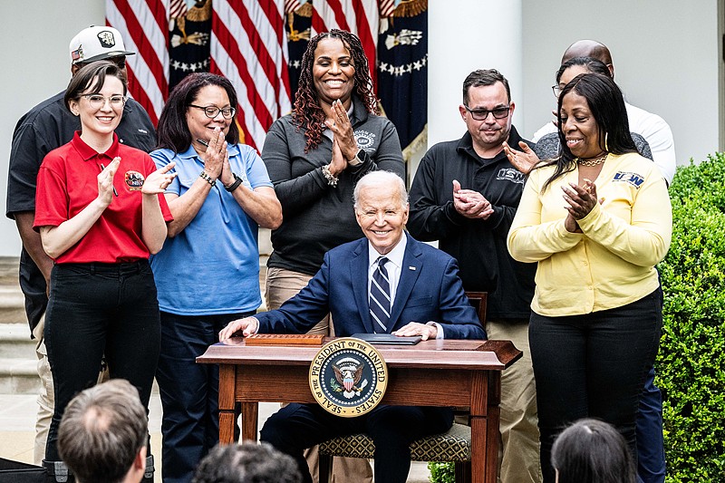 U.S. President Joe Biden sitting at a table where he signed documents related tariffs on goods from China, in the Rose Garden at the White House in Washington, D.C., May 14, 2024. /CFP