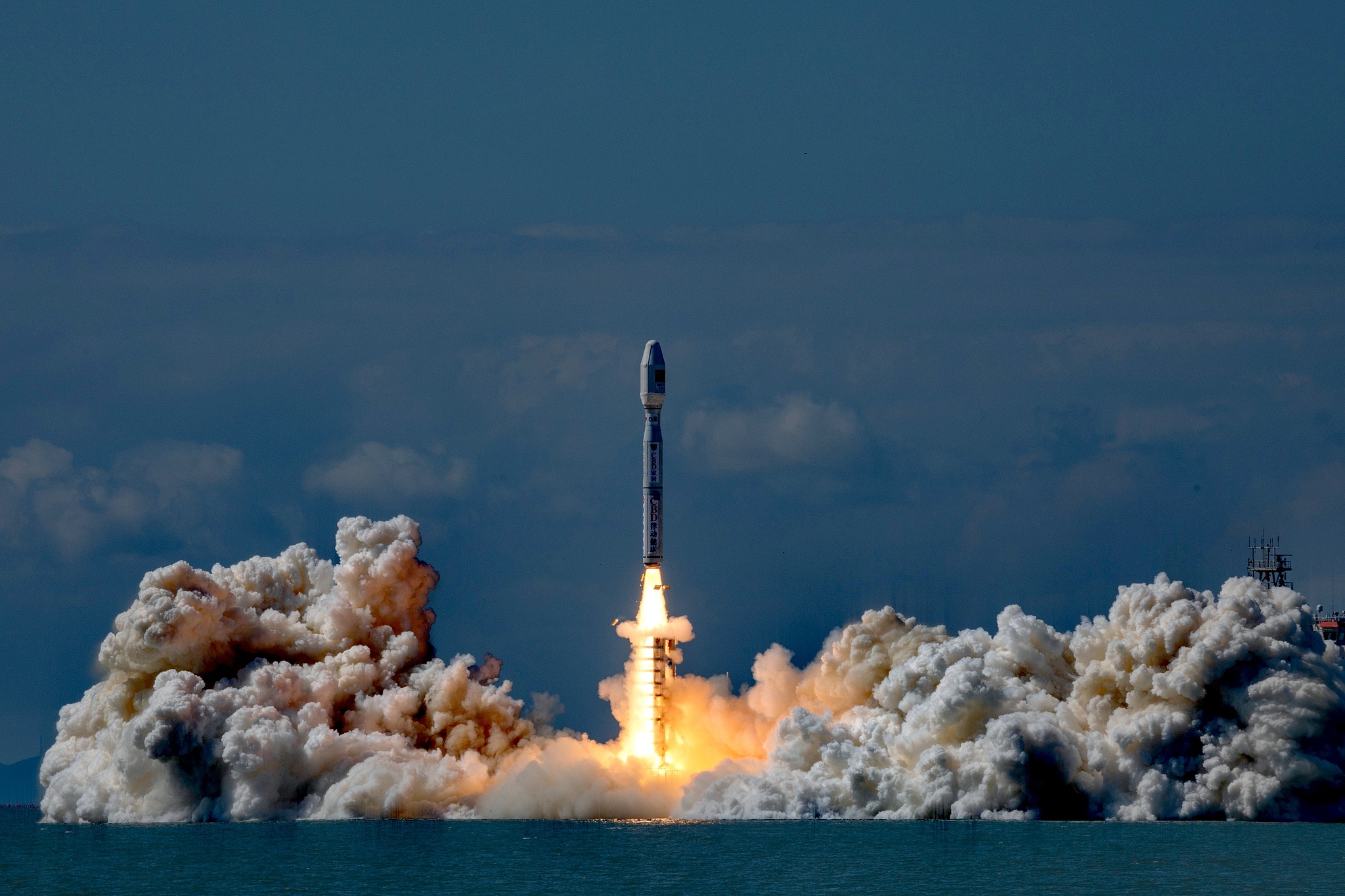 A Smart Dragon-3 carrier rocket carrying eight satellites blasts off from the waters near the city of Haiyang in east China's Shandong Province, September 24, 2024. /CFP
