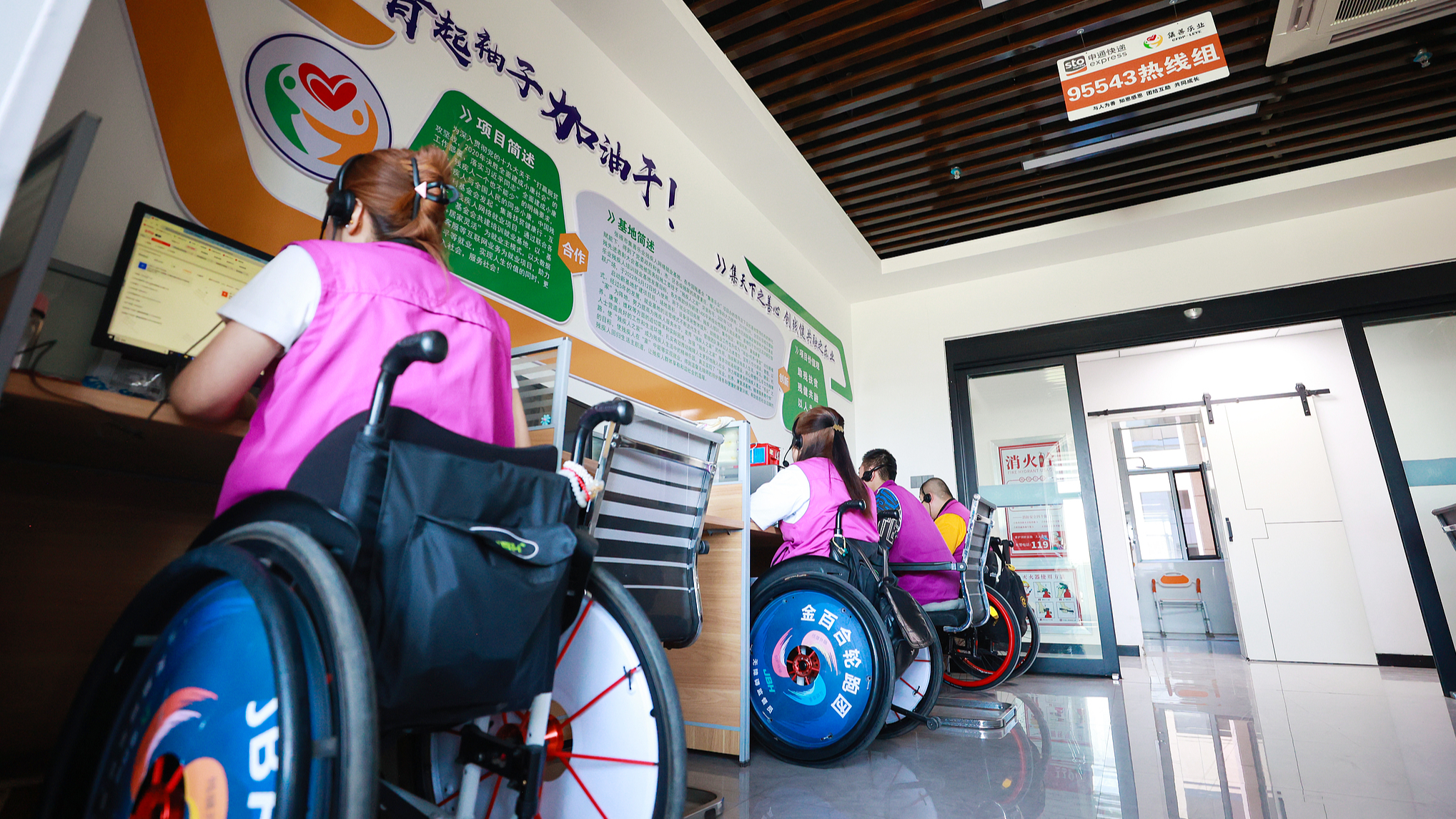 People with disabilities respond to customer requests at a supported employment center for the disabled in Zhangye City, northwest China's Gansu Province, May 13, 2024. /CFP