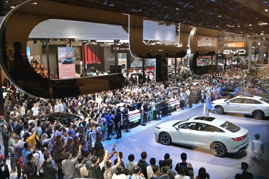 Visitors are seen at the exhibition area of Chinese NEV manufacturer BYD during the 2024 Beijing International Automotive Exhibition in Beijing, capital of China, May 4, 2024. /Xinhua