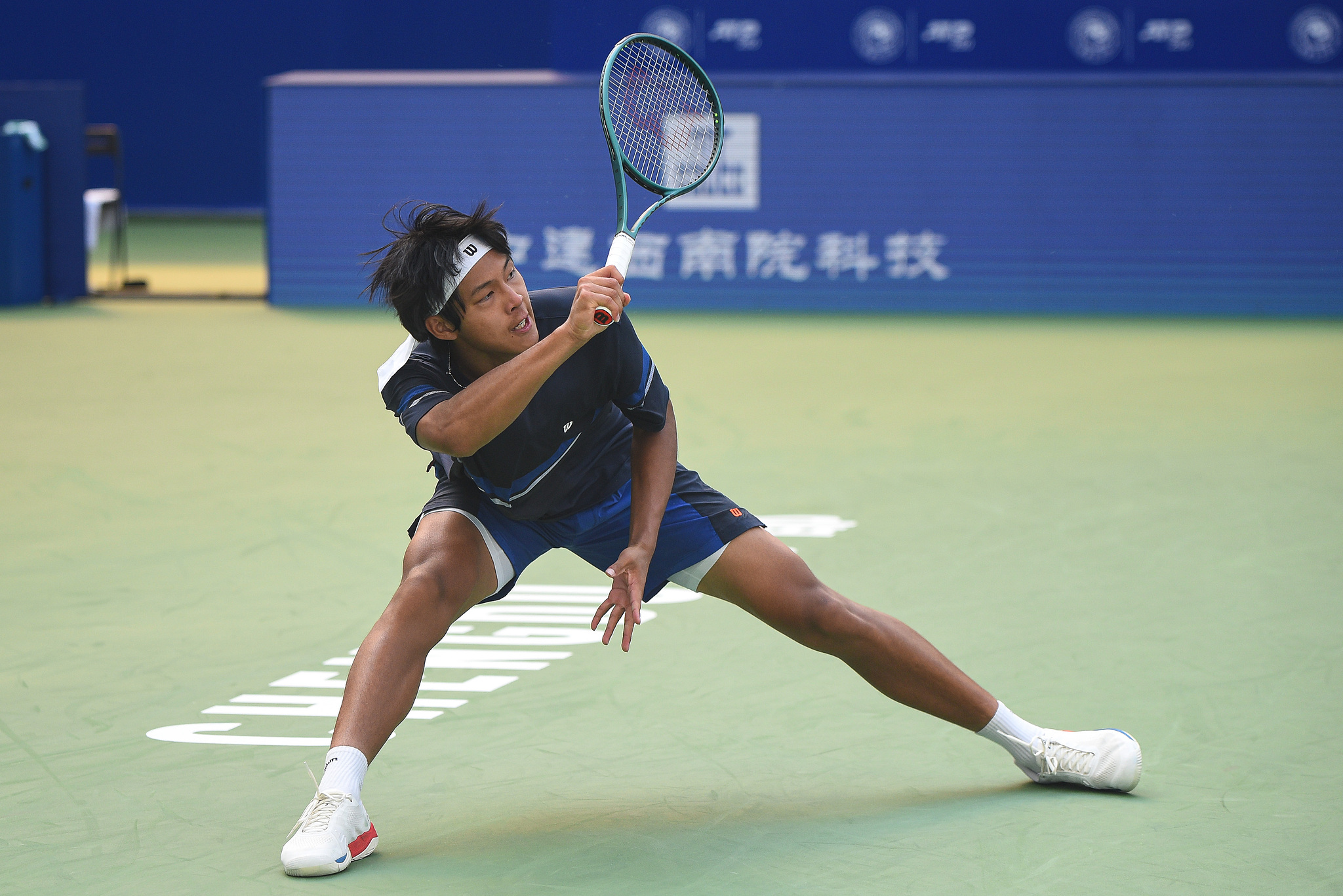 Zhou Yi of China hits a shot against Adrian Mannarino of France in a men's singles match at the Chengdu Open in Chengdu, southwest China's Sichuan Province, September 20, 2024. /CFP