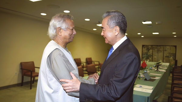 Chinese Foreign Minister Wang Yi (R), also member of the Political Bureau of the CPC Central Committee, meets Muhammad Yunus, leader of the interim government of Bangladesh, on the sidelines of the UN General Assembly in New York, U.S., September 25, 2024. /Chinese Foreign Ministry