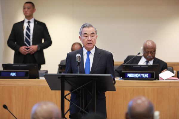 Chinese Foreign Minister Wang Yi addresses the event themed 