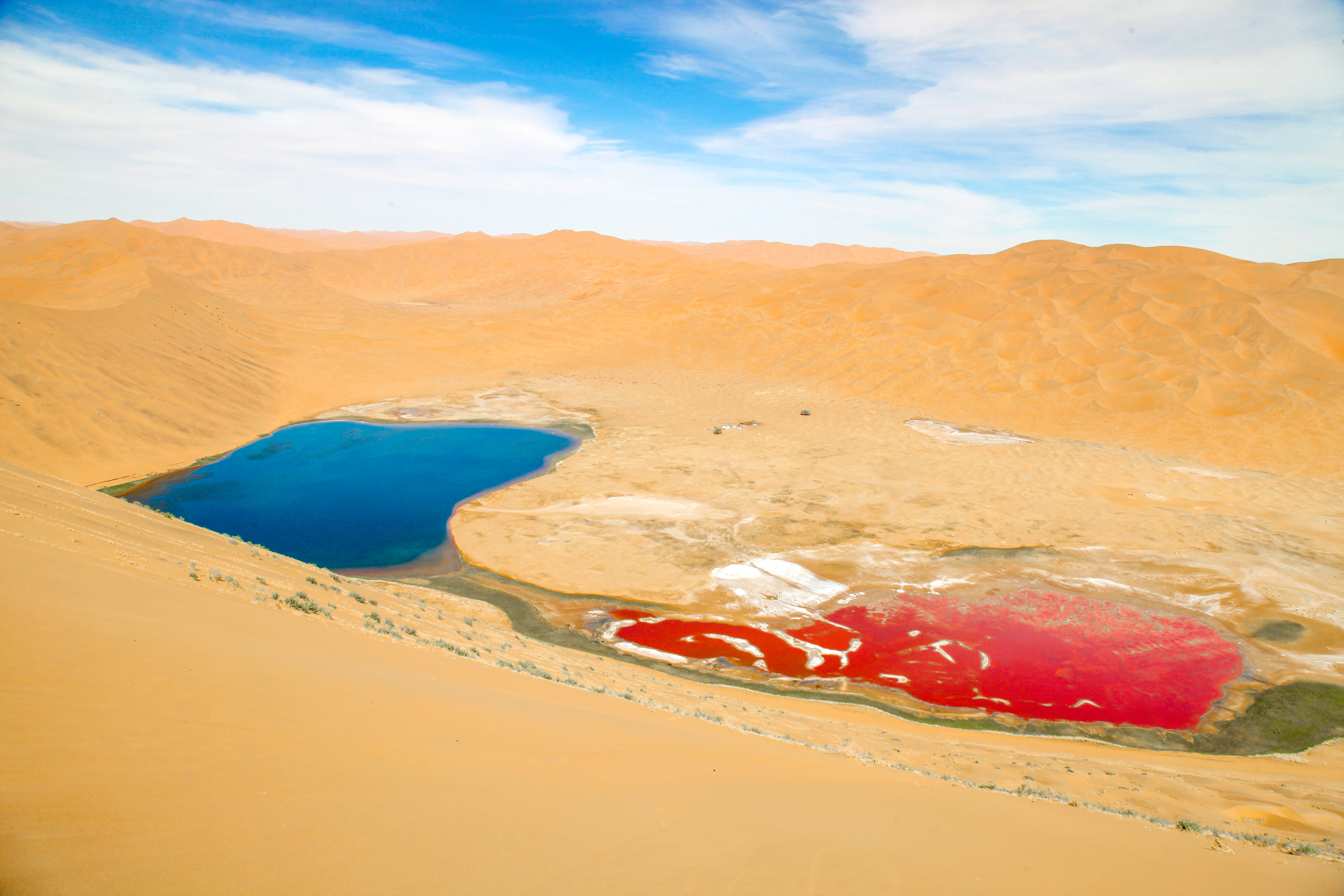 Desert lakes display blue and red colors in Badain Jaran Desert in Inner Mongolia. /Photo provided to CGTN