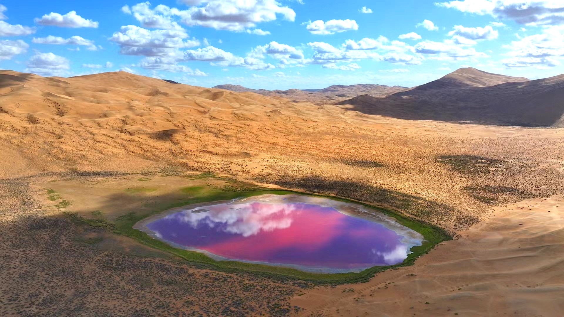 The red interdunal lake (Dagetu) displays pink and purple colors in the Badain Jaran Desert in Inner Mongolia on September 20, 2024. /CGTN