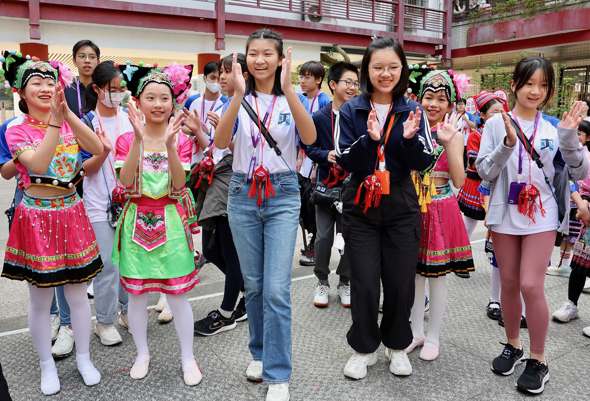 Students from the Hong Kong Special Administrative Region celebrate an ethnic festival with local students in Guilin, south China's Guangxi Zhuang Autonomous Region, March 29, 2024. /CFP