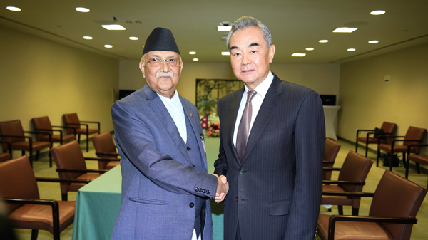 Chinese Foreign Minister Wang Yi (R), also a member of the Political Bureau of the Communist Party of China Central Committee, meets with Nepal's Prime Minister KP Sharma Oli on the sidelines of the UN General Assembly in New York, U.S., September 26, 2024. /Chinese Foreign Ministry