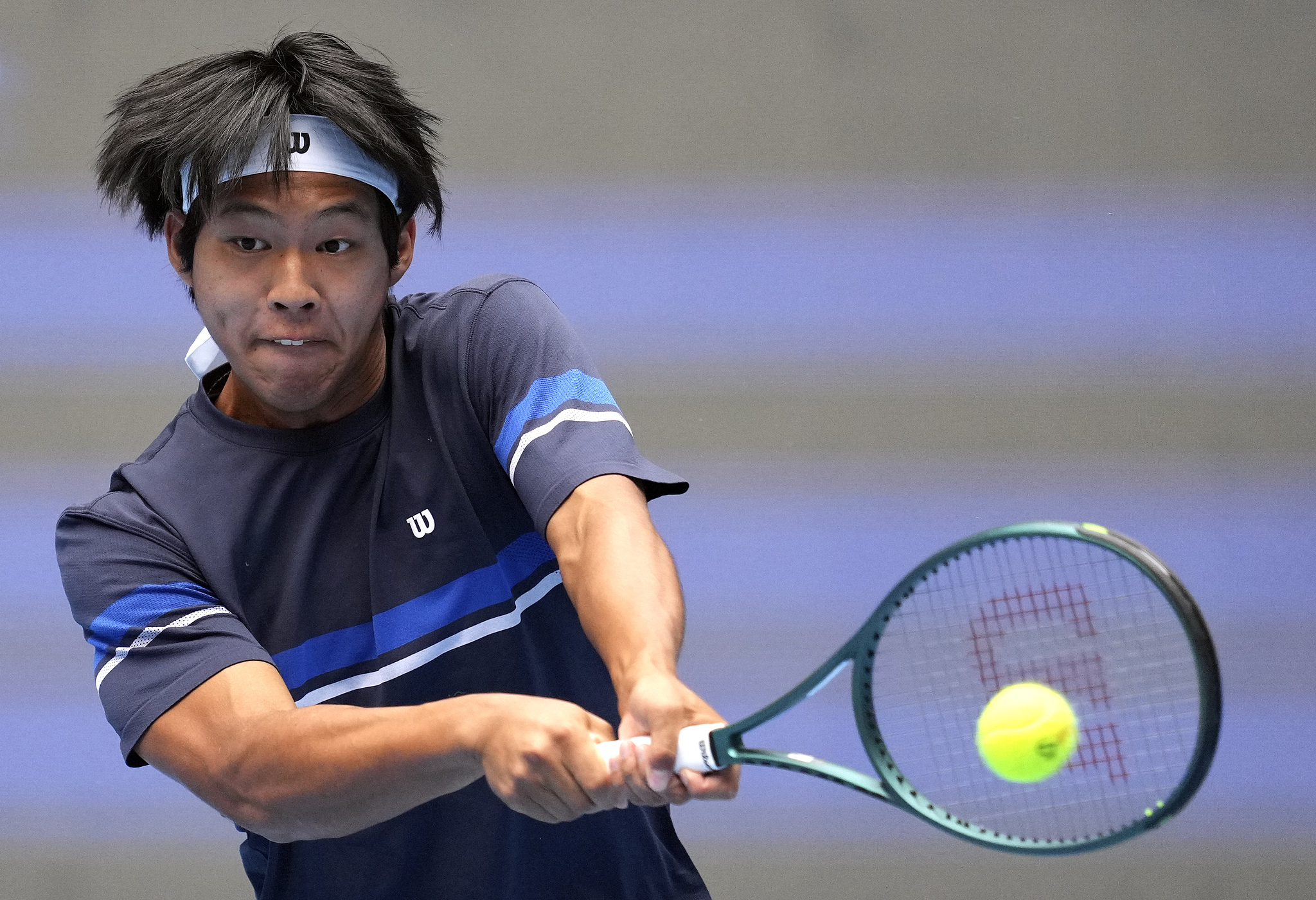 Zhou Yi of China competes in the men's singles first-round match against Pavel Kotov of Russia at the China Open in Beijing, September 26, 2024. /CFP