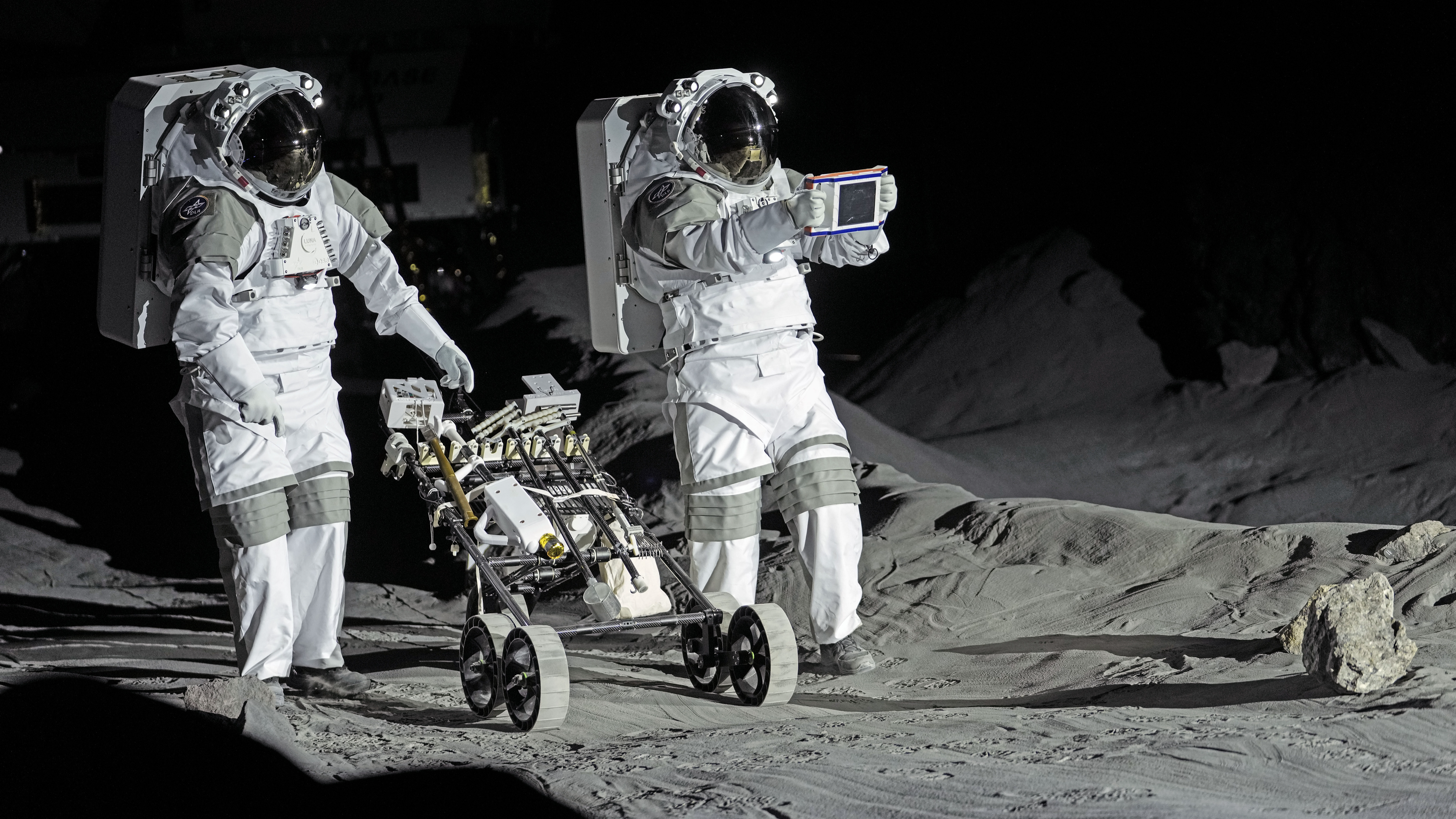 Astronauts Thomas Pesquet of France and Matthias Maurer of Germany demonstrate their training in lunar surface simulating conditions for future moon missions, like the Artemis lunar exploration program led by NASA, at the opening of the new LUNA facility at the European Astronaut Center in Cologne, Germany, September 25, 2024. /CFP