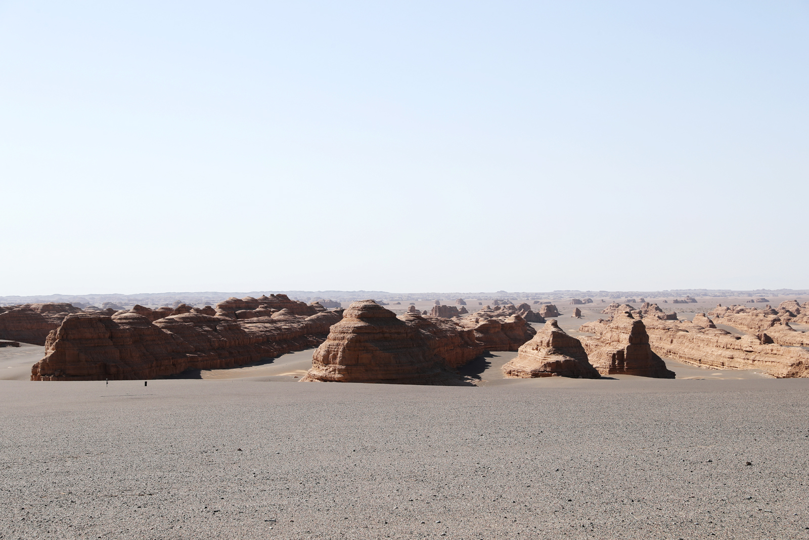 Wind-eroded rocks resembling a grand fleet sailing across the sea are seen at Dunhuang Yardang National Geopark in Gansu Province. /CGTN