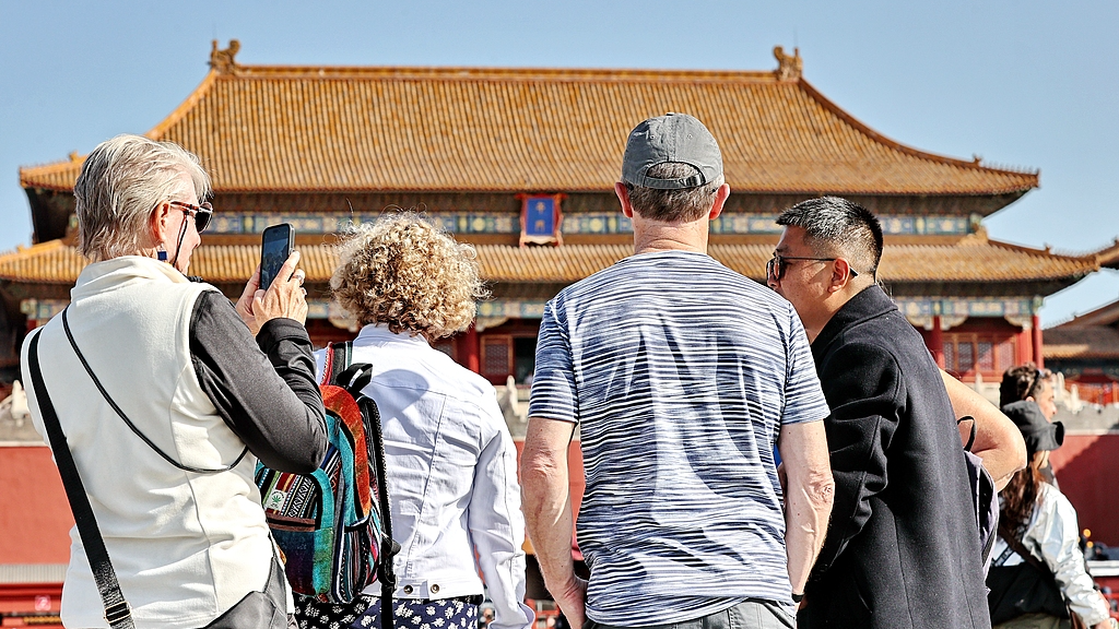 Foreign tourists visit the Forbidden City, Beijing, China, April 7, 2024. /CFP
