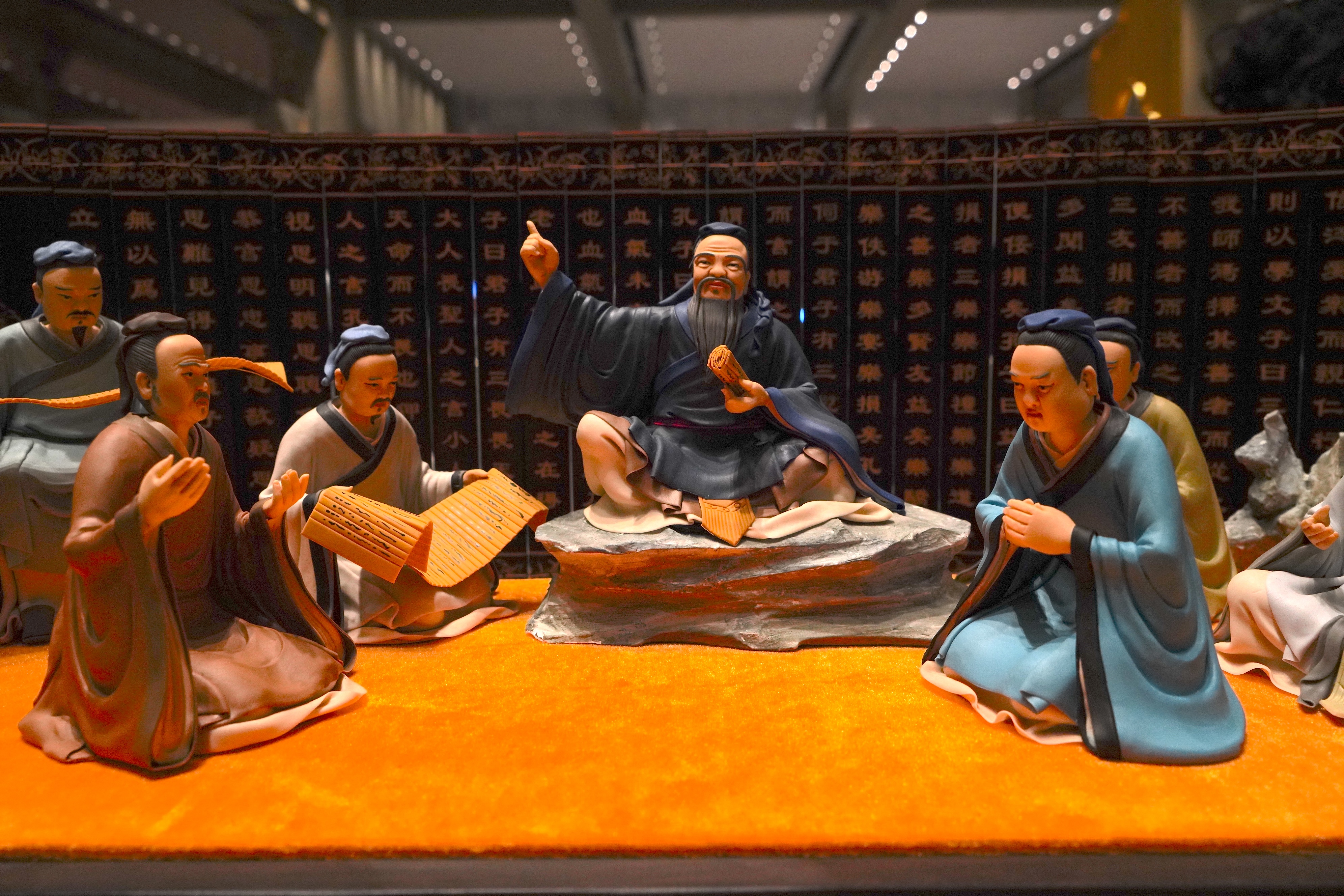 Dough sculptures showing Confucius conducting a lesson are on display at the 2024 China International Confucius Cultural Festival in Qufu, Shandong Province. /CGTN