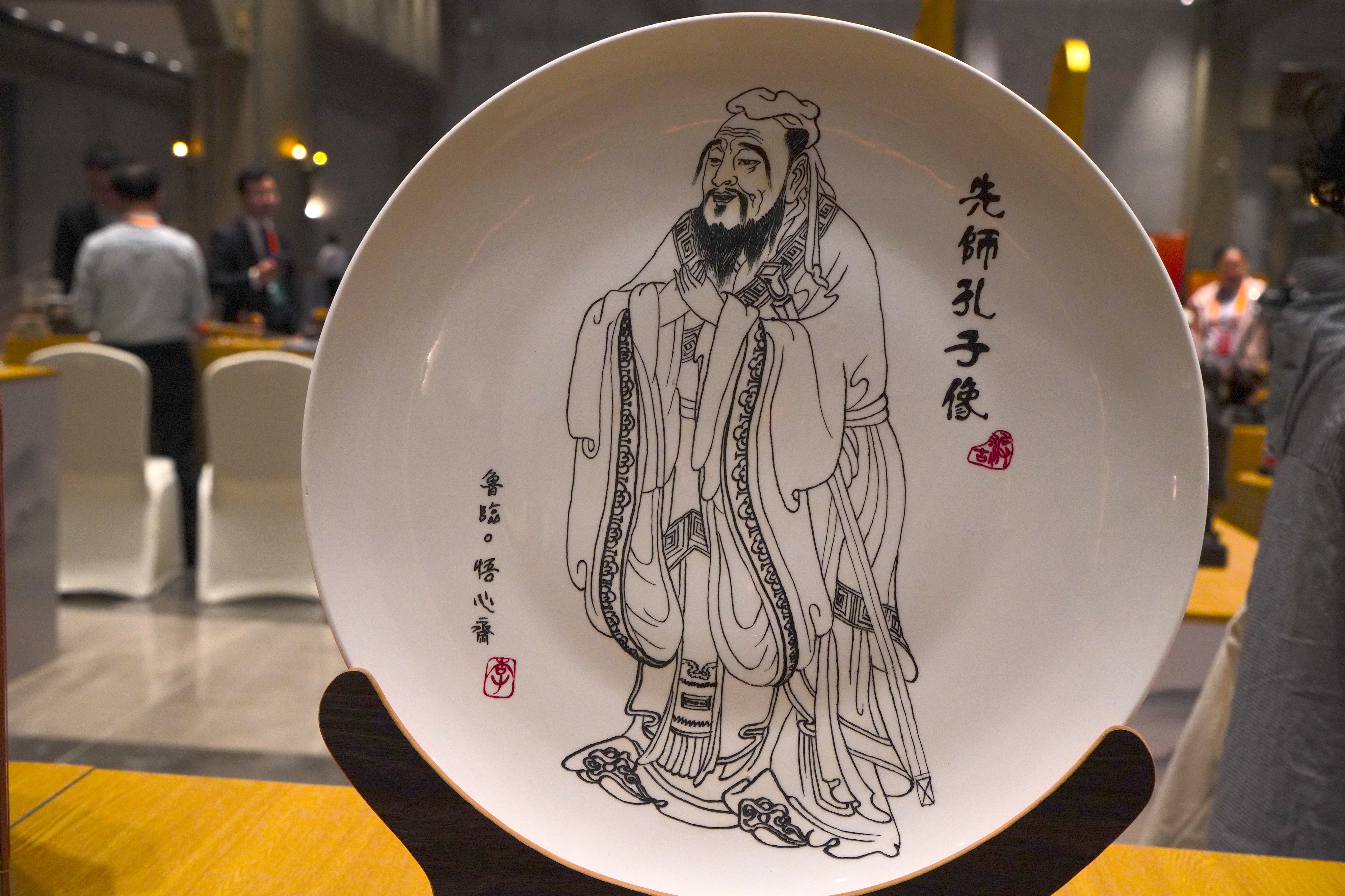 A portrait of Confucius etched onto a ceramic plate is on display at the 2024 China International Confucius Cultural Festival in Qufu, Shandong Province. /CGTN