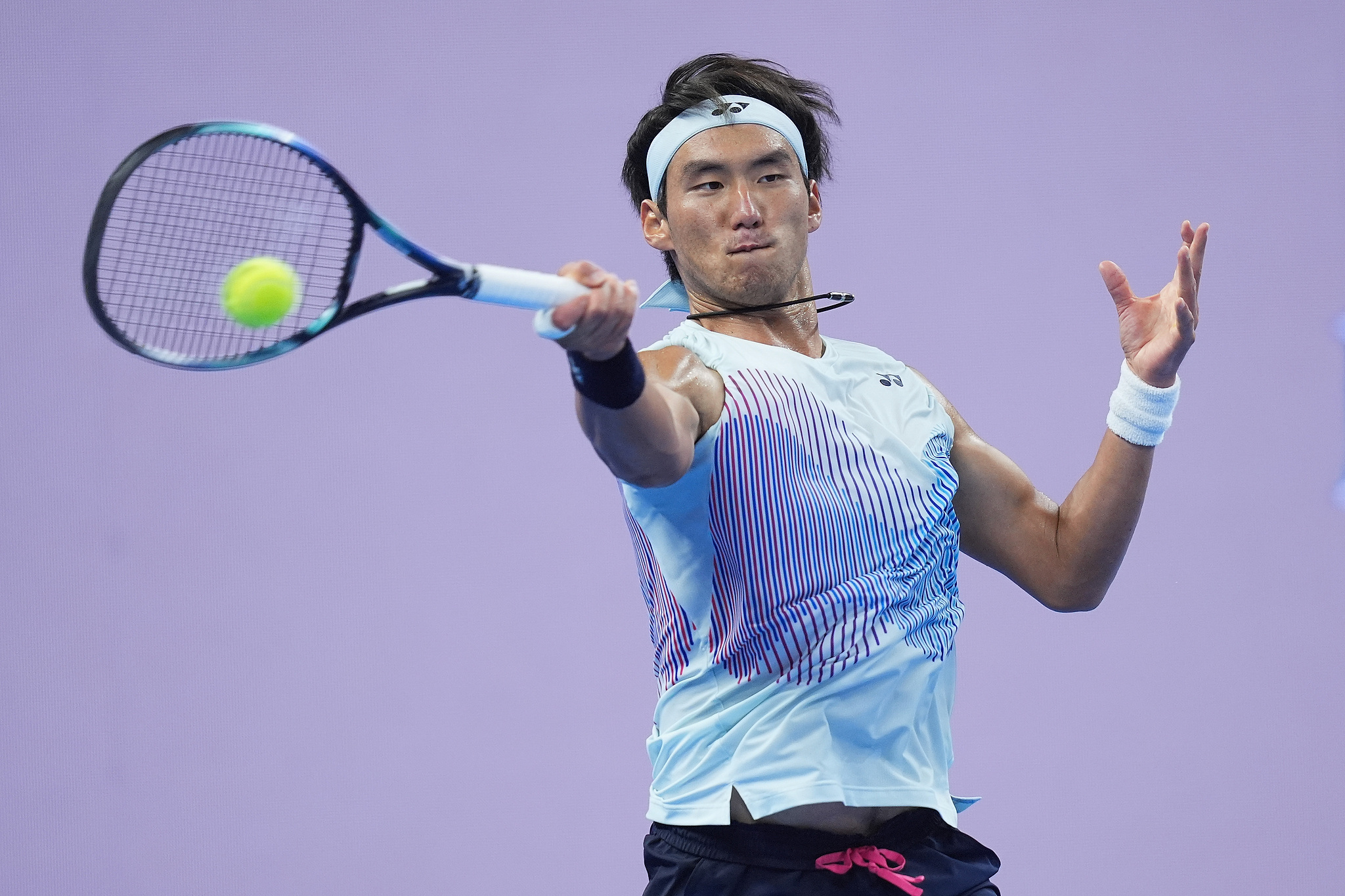 Buyunchaokete of China hits a shot against Jannik Sinner of Italy in the men's singles semifinals at the China Open in Beijing, October 1, 2024. /CFP