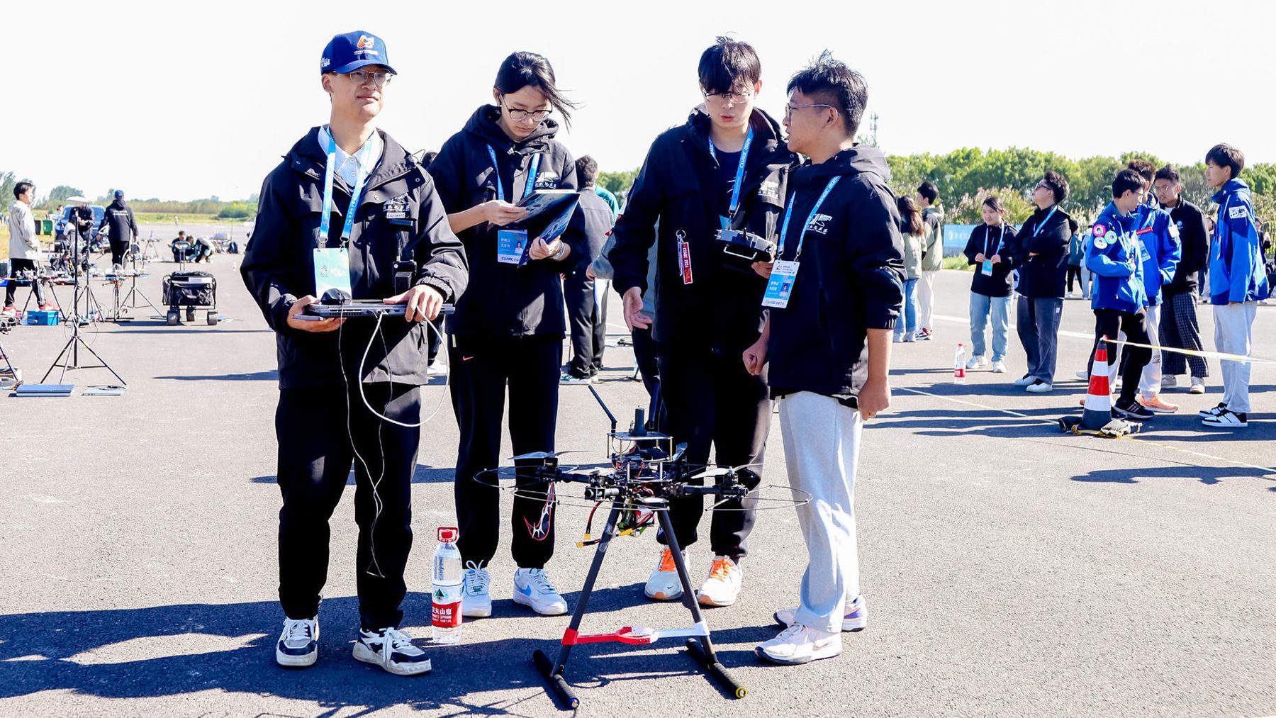 A group of contestants inspect their aircraft during the 2024 China University Aircraft Design Competition, Dingzhou City, Hebei Province, north China, October 1, 2024. /Chinese Society of Aeronautics and Astronautics, 2024 China University Aircraft Design Competition