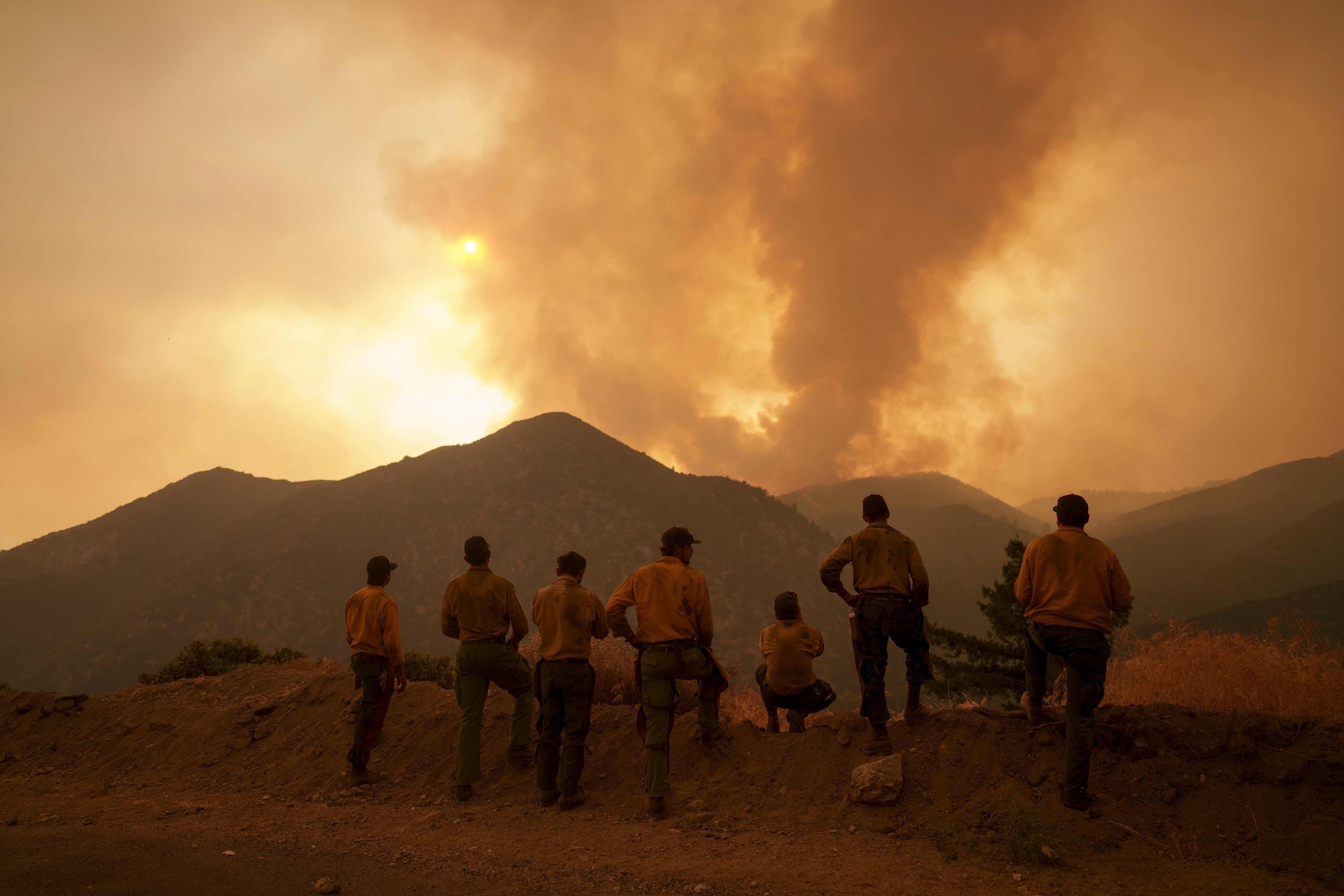 Firefighters monitor the advancing Line Fire in Angelus Oaks, California, U.S., Monday, September 9, 2024. /AP