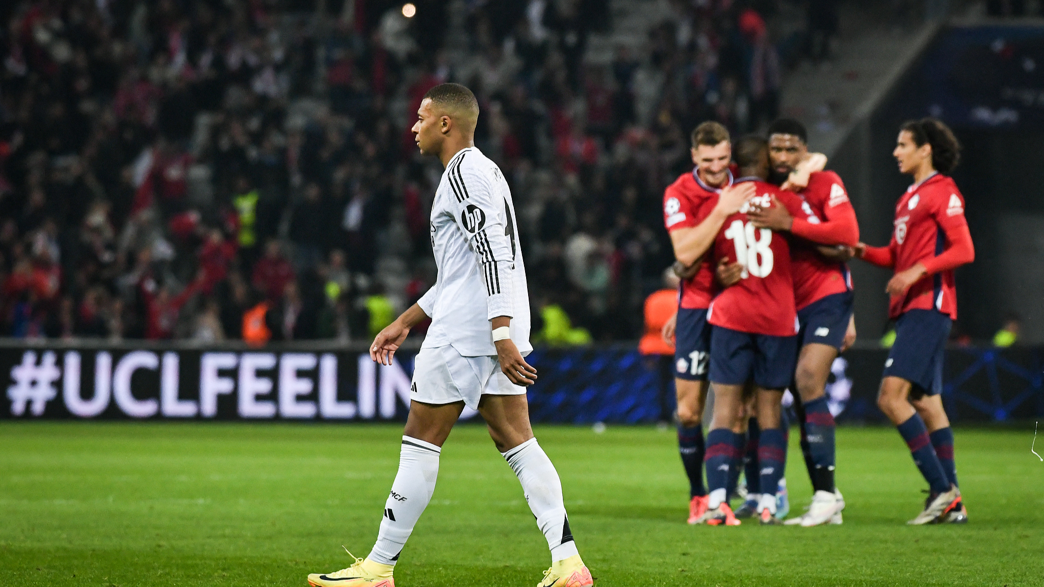 Kylian Mbappe (L) looks dejected after Real Madrid lost to Lille in Champions League group stage in Lille, France, October 2, 2024. /CFP